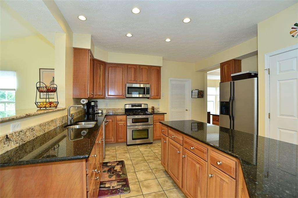 227 Field Club Circle McKees Rocks, PA 15136 - Photo 10 of 25 Kitchen - With Granite Counter Top, Angled CenterIsland, Stainless Steel Appliances