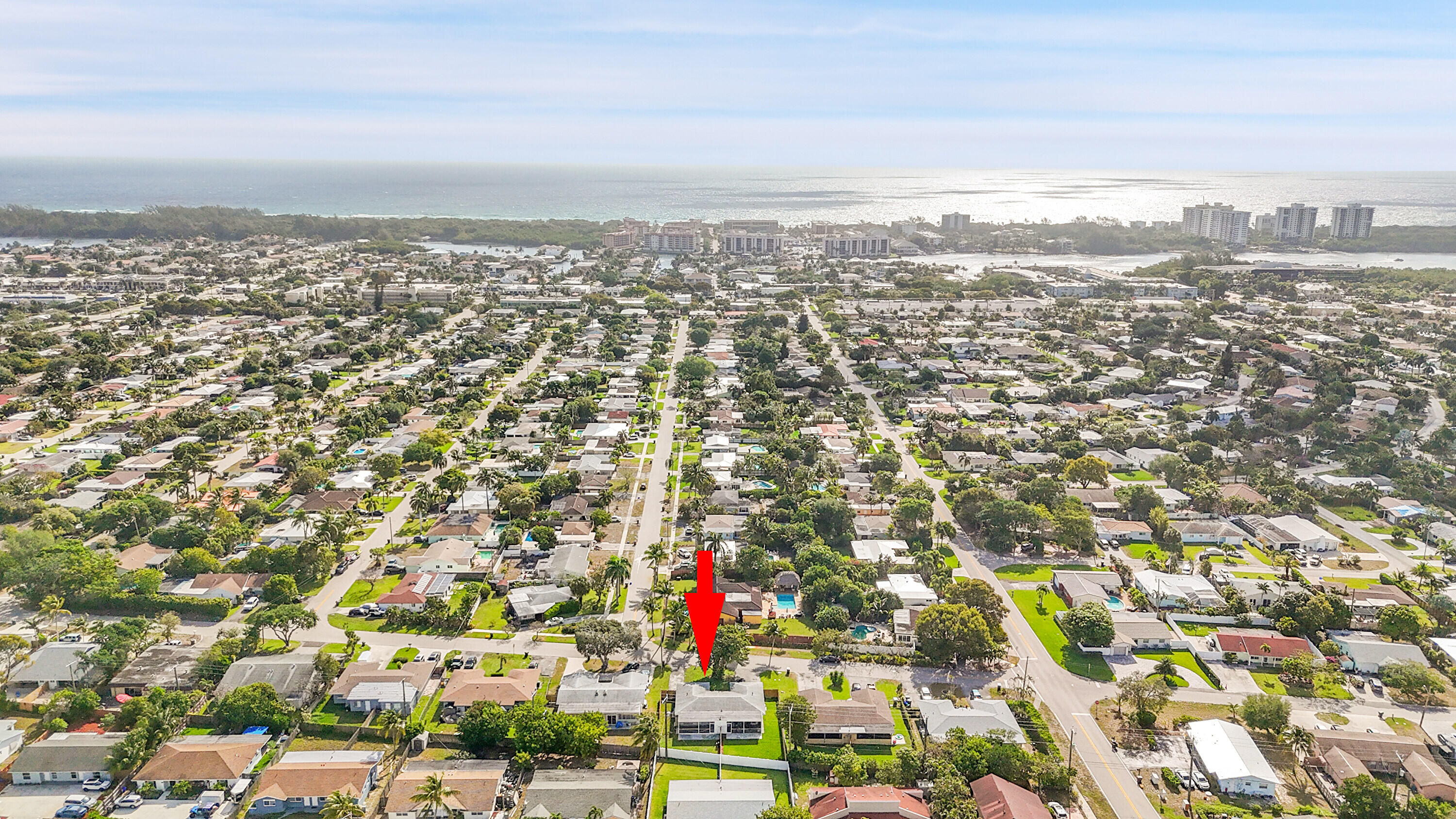 an aerial view of residential building and trees