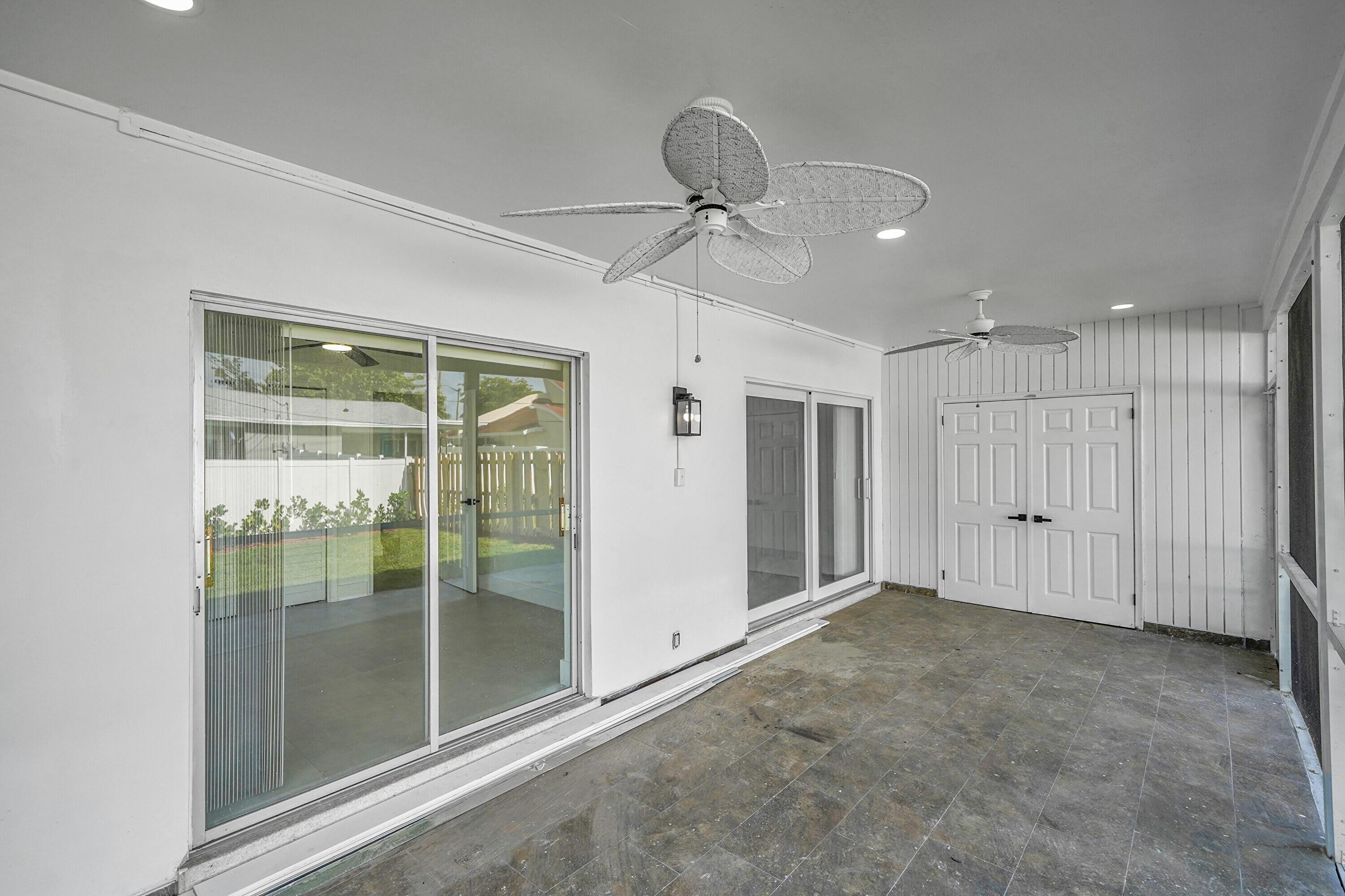2821 Northeast 2nd Avenue, Unit 2823 Boca Raton, FL 33431 - Photo 16 of 38 a view of an empty room with sliding door