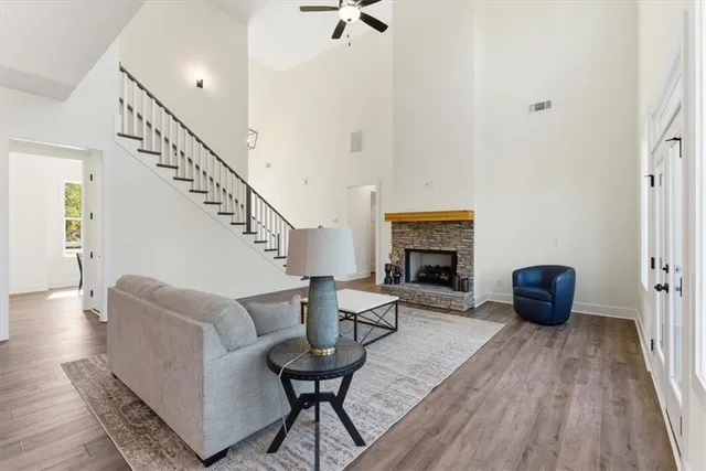 a living room with furniture and a fireplace