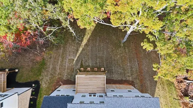 an aerial view of a house with swimming pool