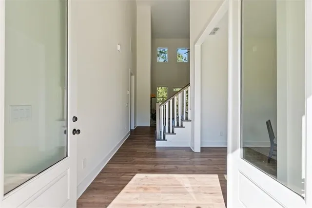 a view of a hallway with a door
