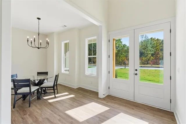 a view of a room with furniture window and wooden floor