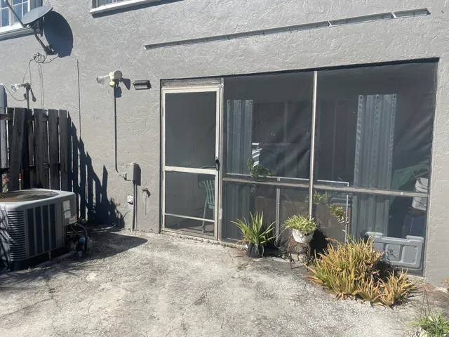a view of a balcony with chairs