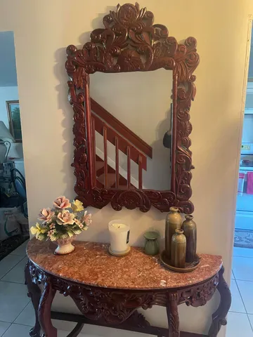 a view of a house with a table and chairs