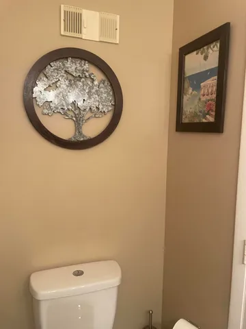 a bathroom with a toilet and a sink