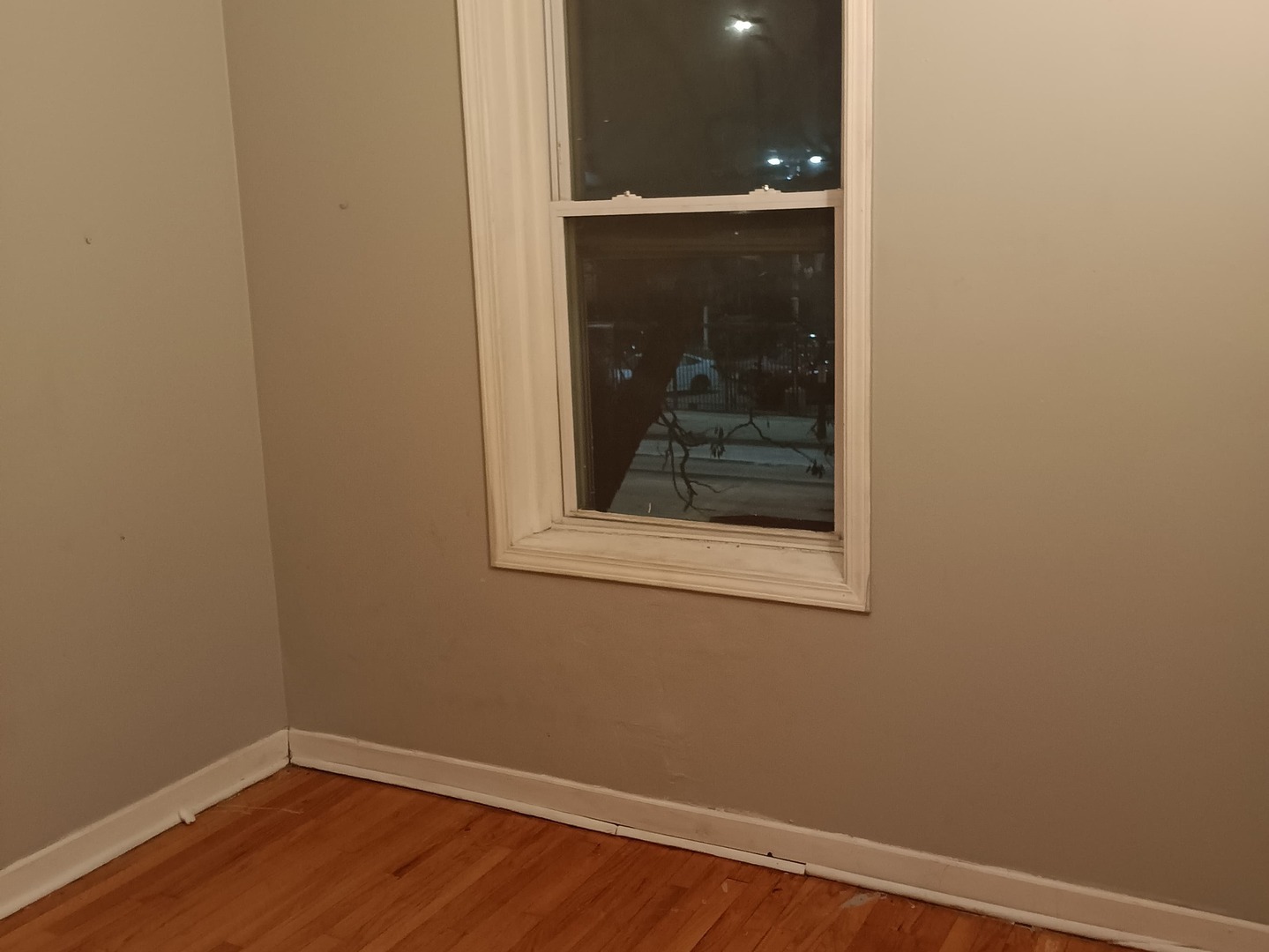 4846 South Pulaski Road, Unit 2 Chicago, IL 60632 - Photo 8 of 9 a view of a small space with wooden floor and a window
