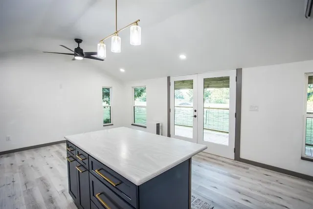 a kitchen with a table and chairs