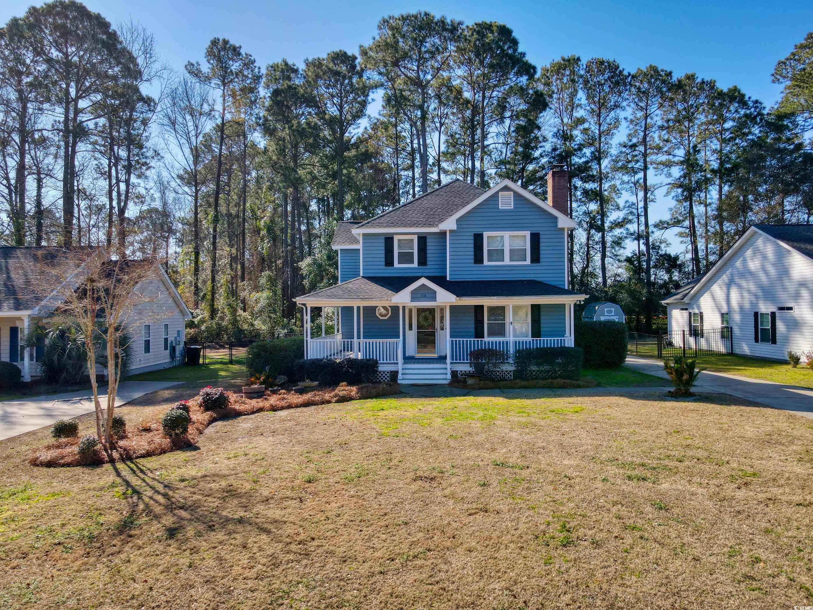 116 Great Lakes Road Pawleys Island, SC 29585 - Photo 1 of 37 View of front of property with covered porch and a