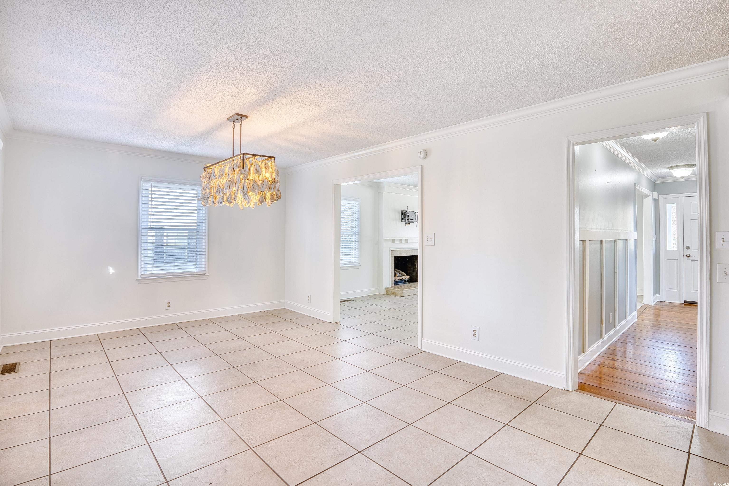 116 Great Lakes Road Pawleys Island, SC 29585 - Photo 11 of 37 Unfurnished room featuring light tile patterned fl