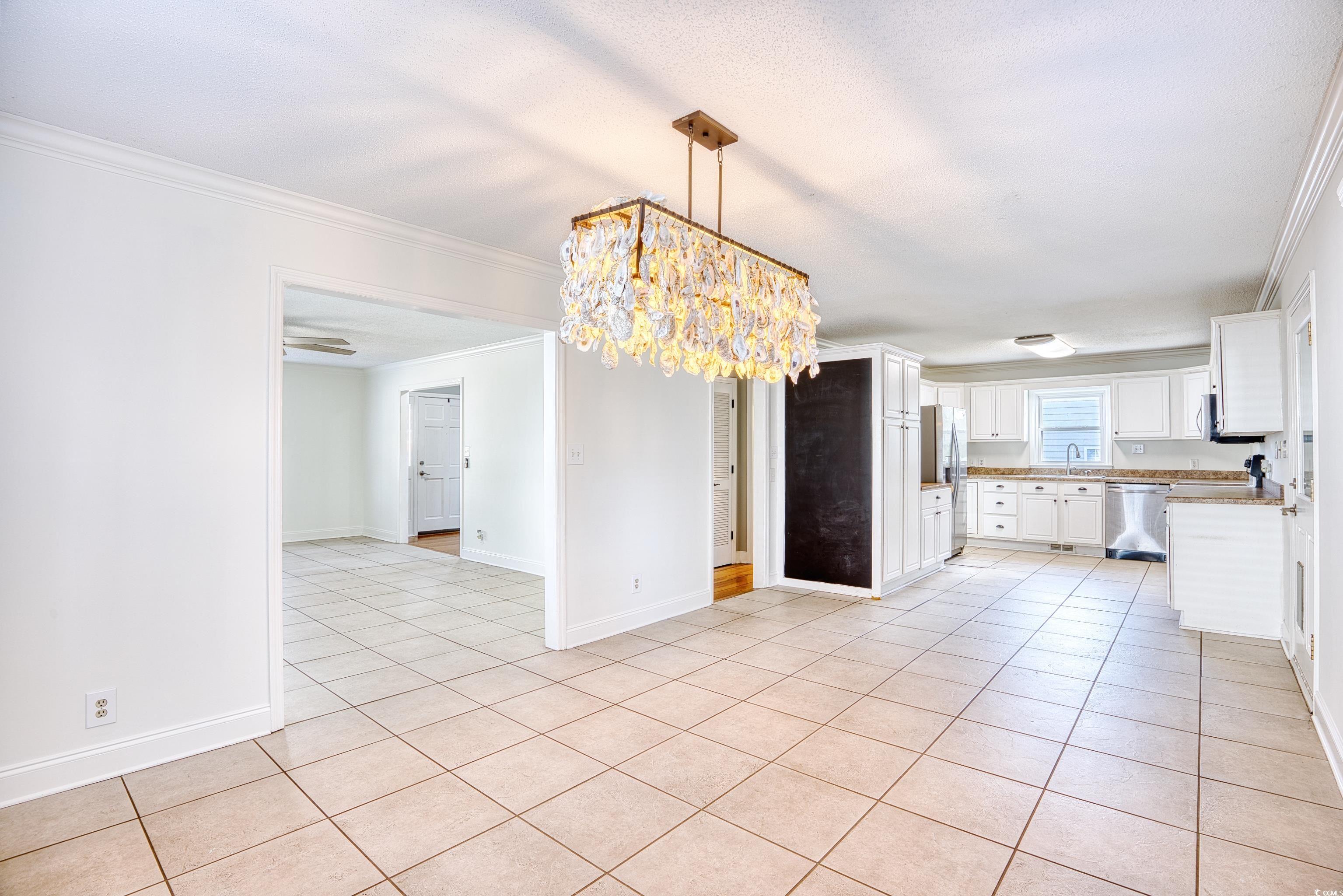 116 Great Lakes Road Pawleys Island, SC 29585 - Photo 12 of 37 Kitchen with light tile patterned floors, decorati