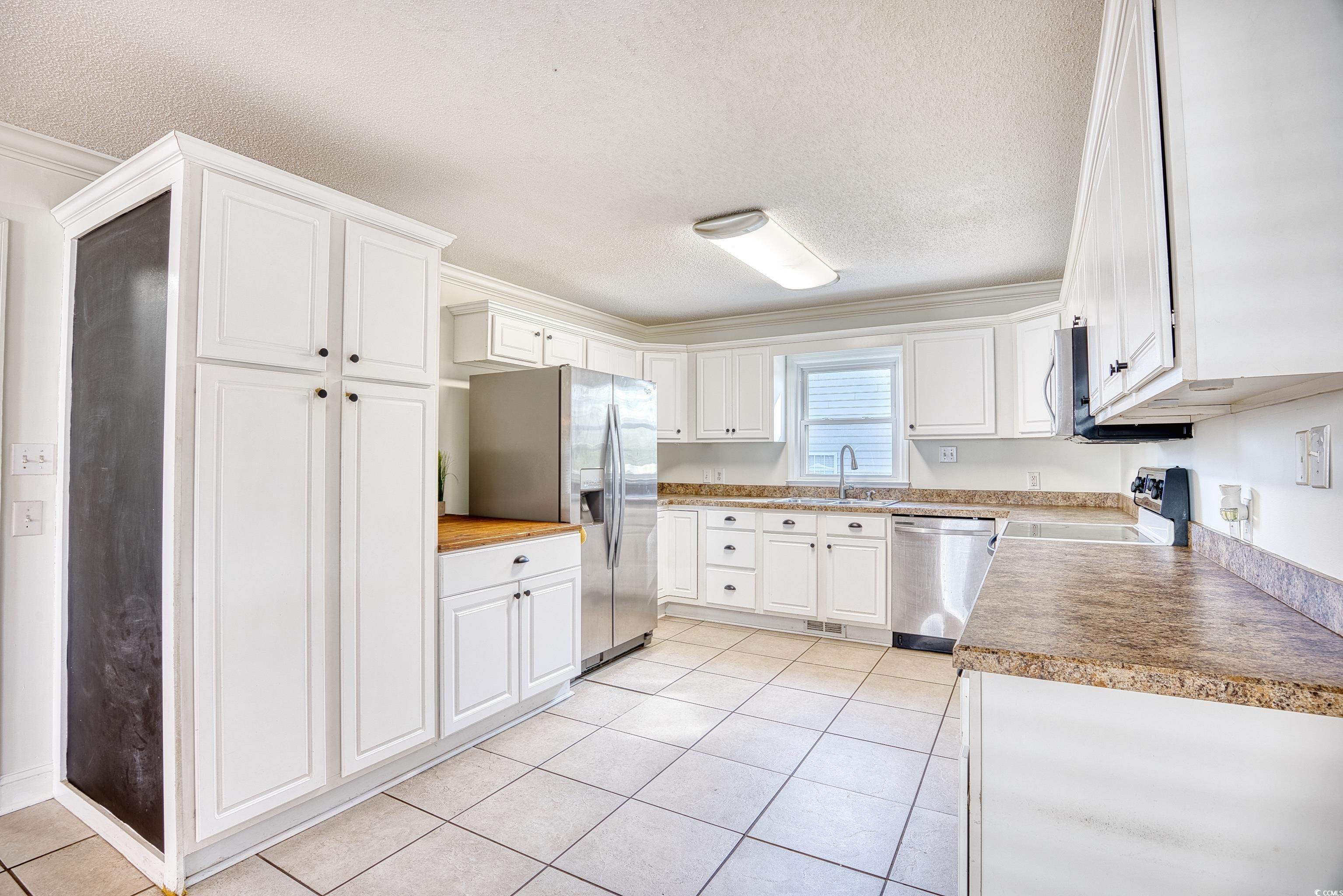 116 Great Lakes Road Pawleys Island, SC 29585 - Photo 14 of 37 Kitchen with sink, stainless steel appliances, a t