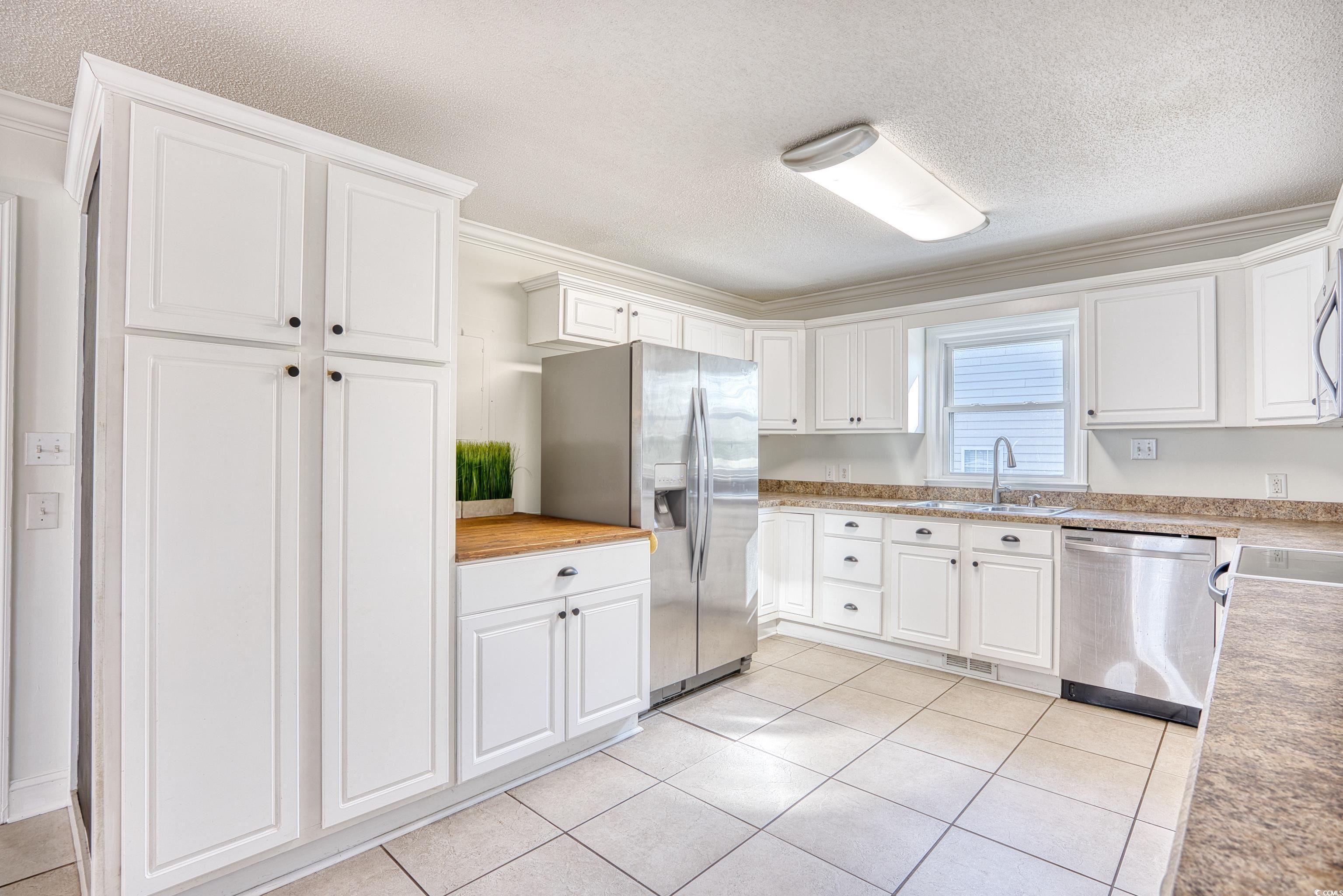 116 Great Lakes Road Pawleys Island, SC 29585 - Photo 16 of 37 Kitchen featuring white cabinetry, stainless steel