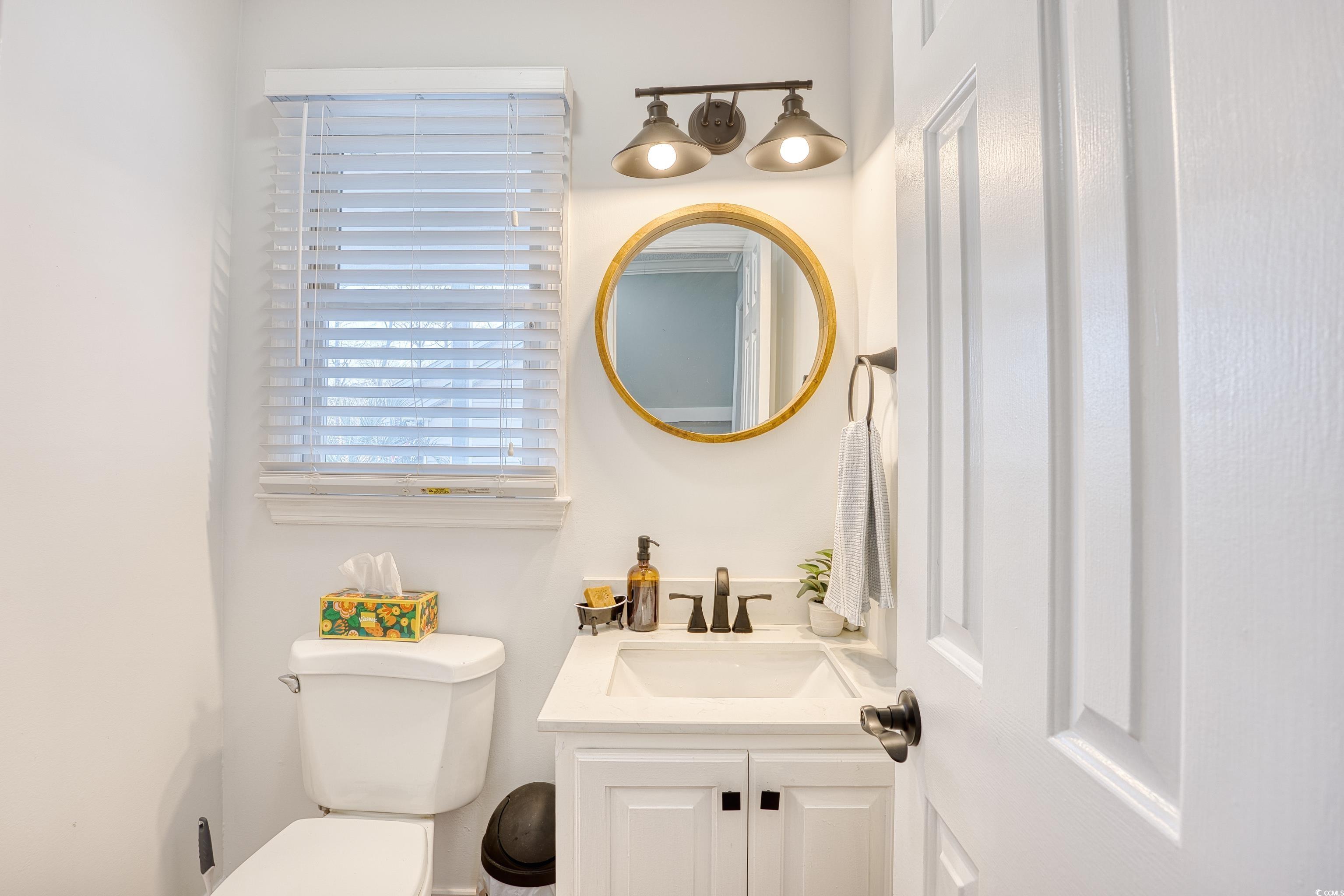 116 Great Lakes Road Pawleys Island, SC 29585 - Photo 17 of 37 Bathroom featuring vanity and toilet