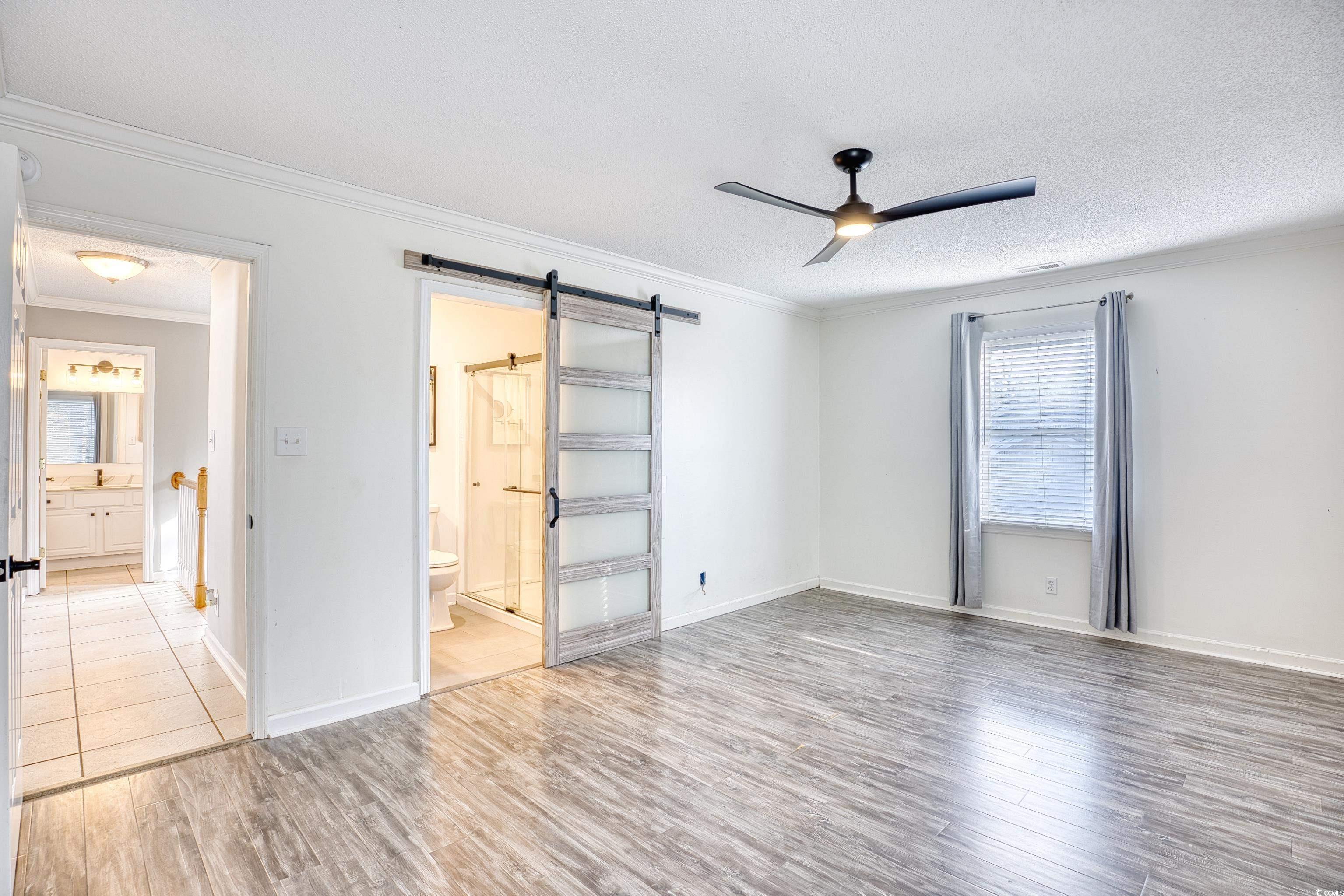 116 Great Lakes Road Pawleys Island, SC 29585 - Photo 20 of 37 Unfurnished bedroom with crown molding, wood-type
