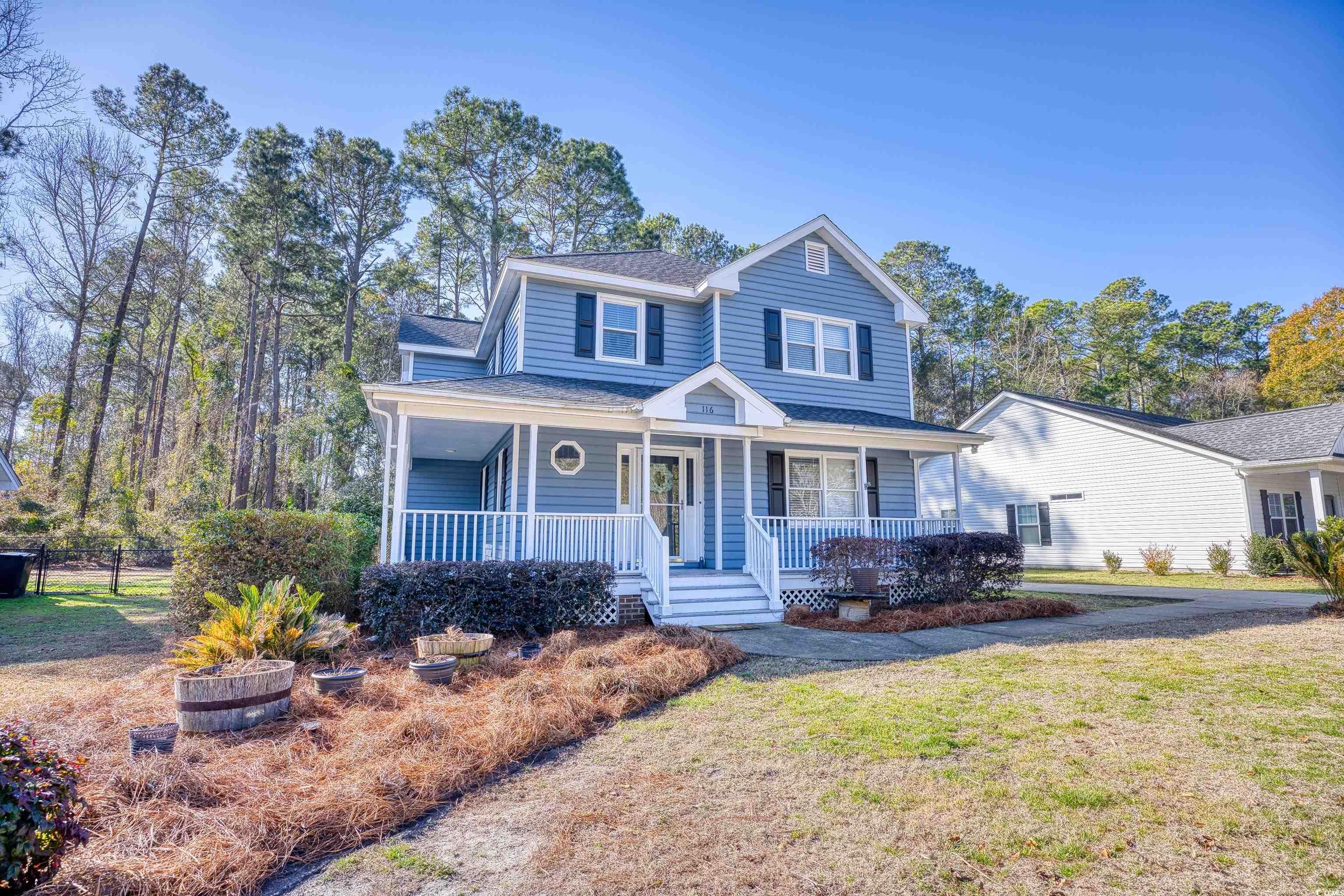 116 Great Lakes Road Pawleys Island, SC 29585 - Photo 2 of 37 View of front of home featuring a front yard and c