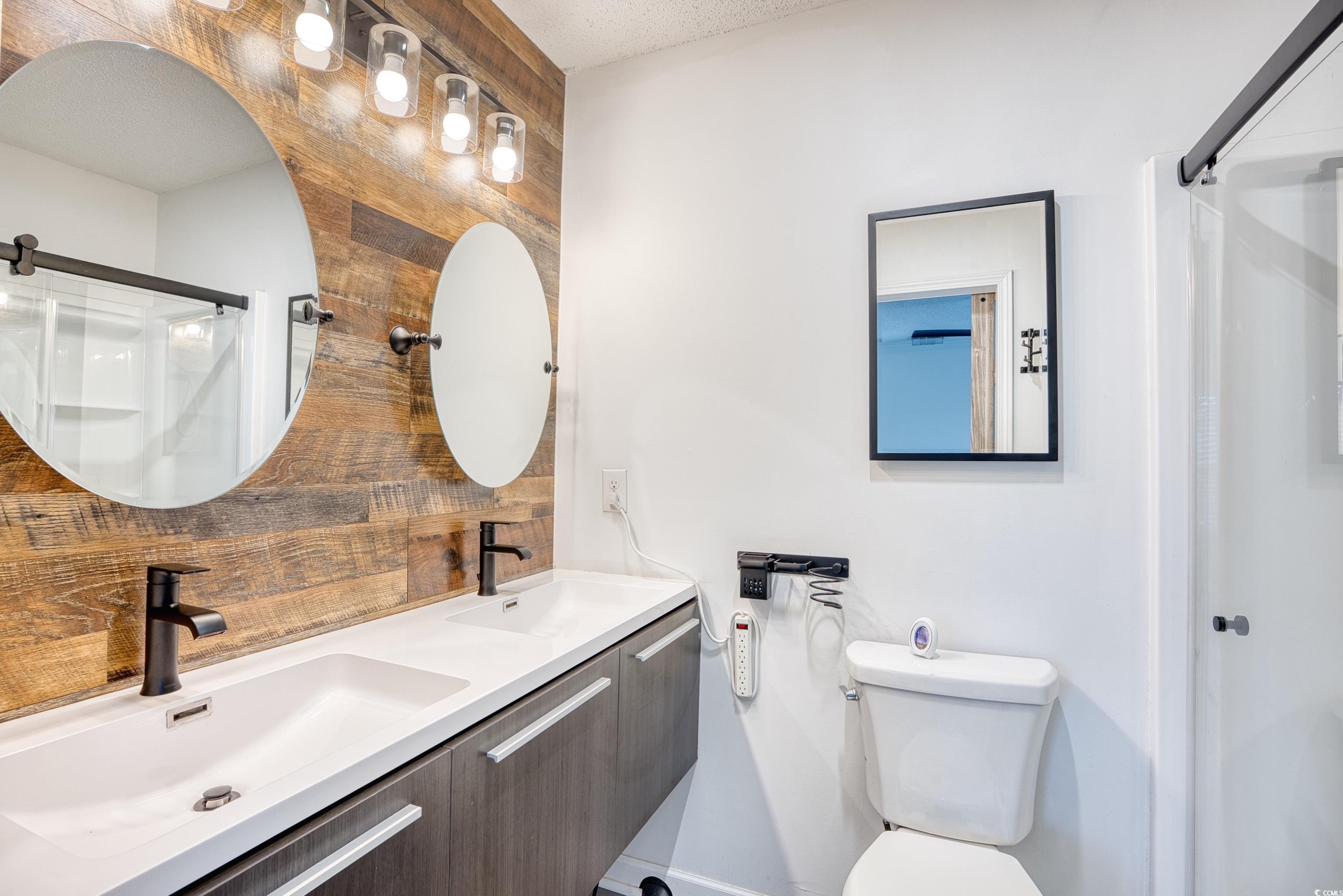 116 Great Lakes Road Pawleys Island, SC 29585 - Photo 22 of 37 Bathroom with vanity, an enclosed shower, and toil