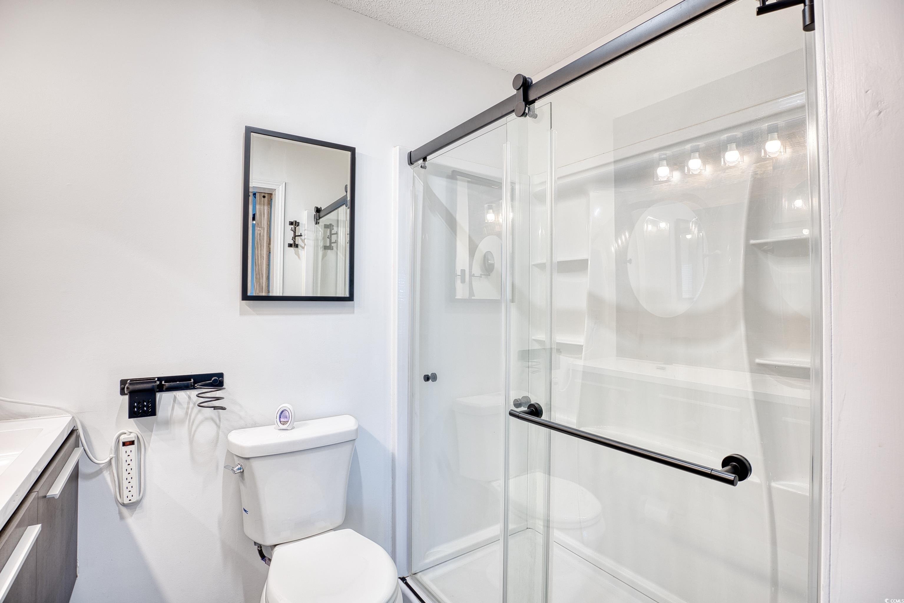 116 Great Lakes Road Pawleys Island, SC 29585 - Photo 23 of 37 Bathroom with vanity, toilet, an enclosed shower,