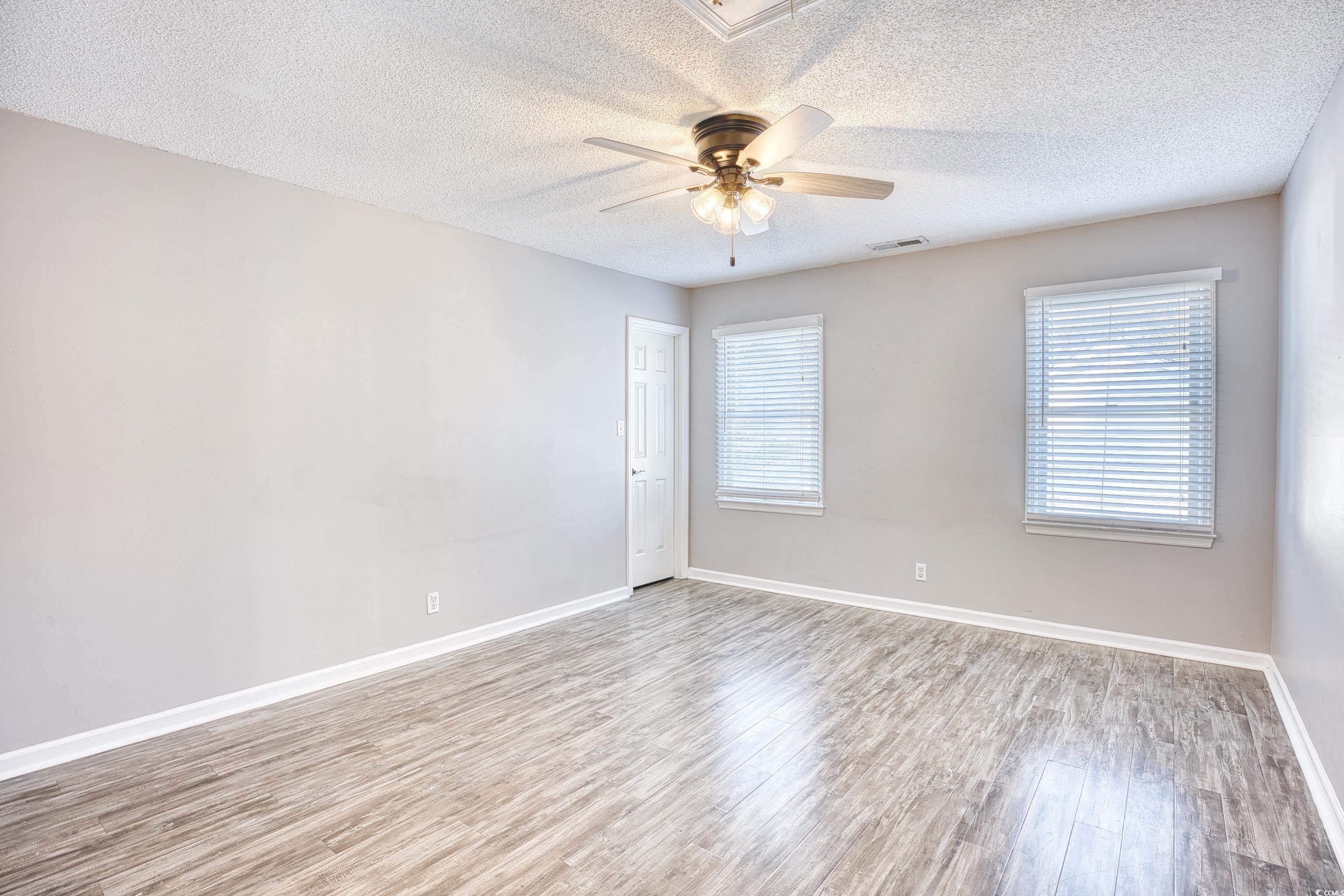 116 Great Lakes Road Pawleys Island, SC 29585 - Photo 27 of 37 Empty room featuring a textured ceiling, ceiling f