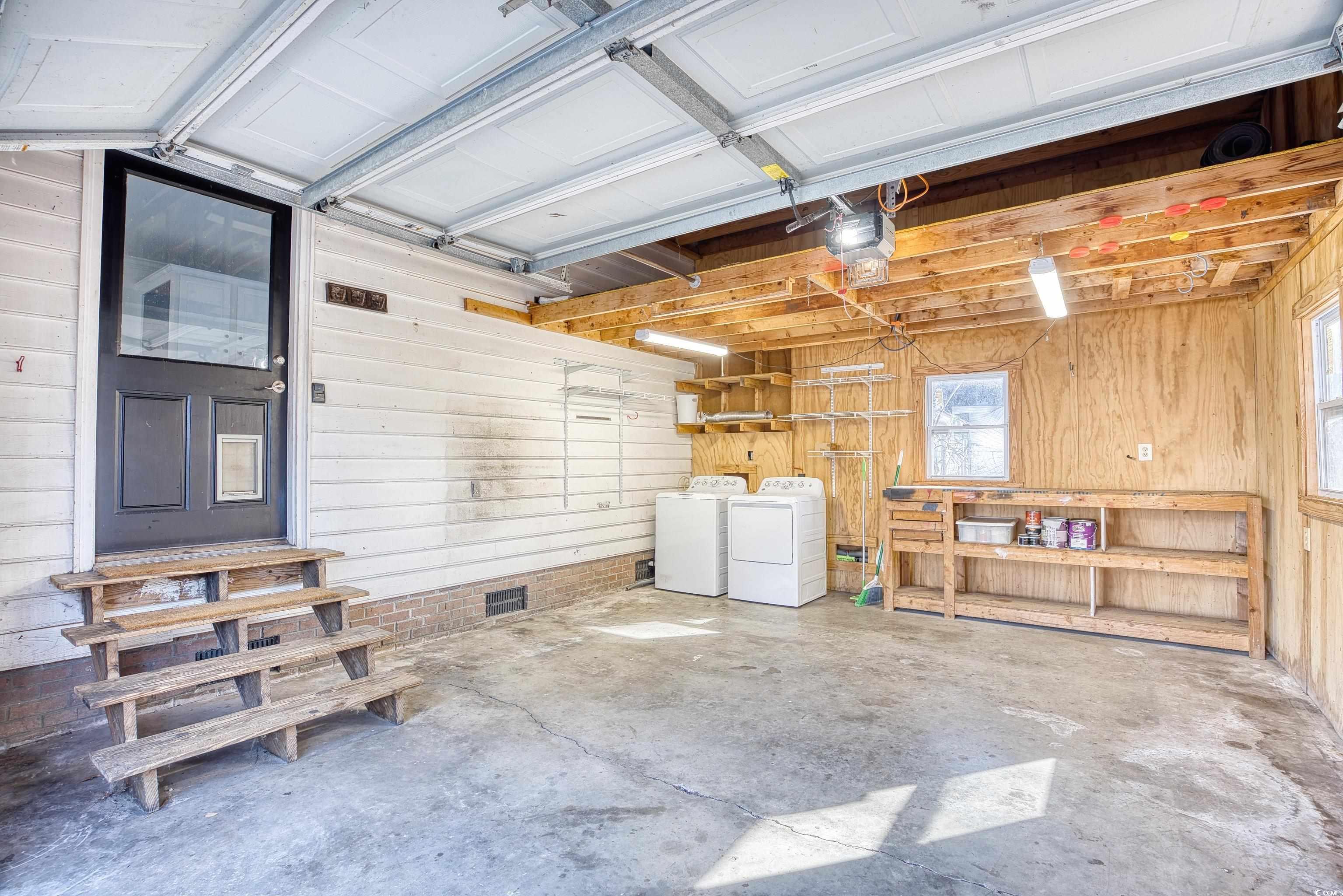 116 Great Lakes Road Pawleys Island, SC 29585 - Photo 28 of 37 Garage featuring washer and clothes dryer and wood