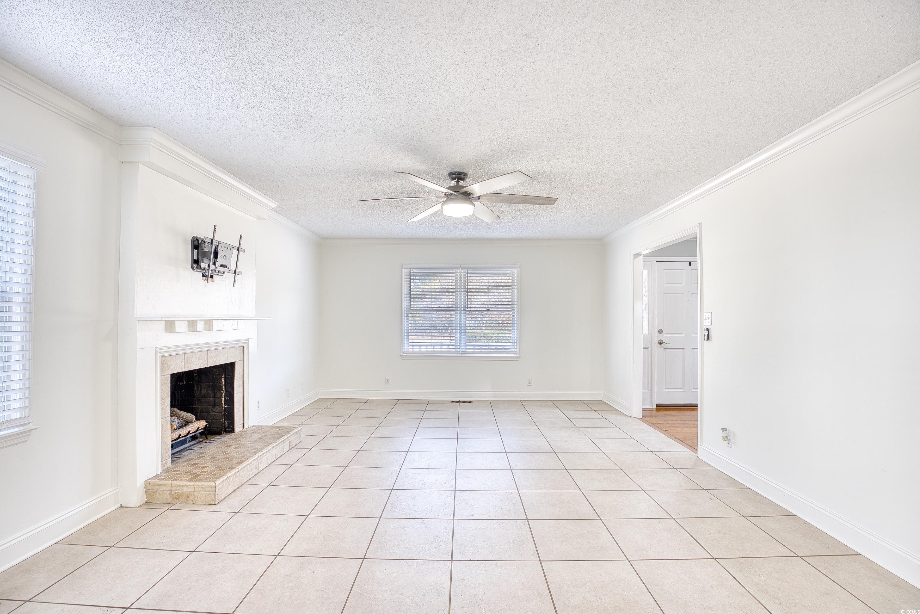 116 Great Lakes Road Pawleys Island, SC 29585 - Photo 10 of 37 Unfurnished living room with light tile patterned