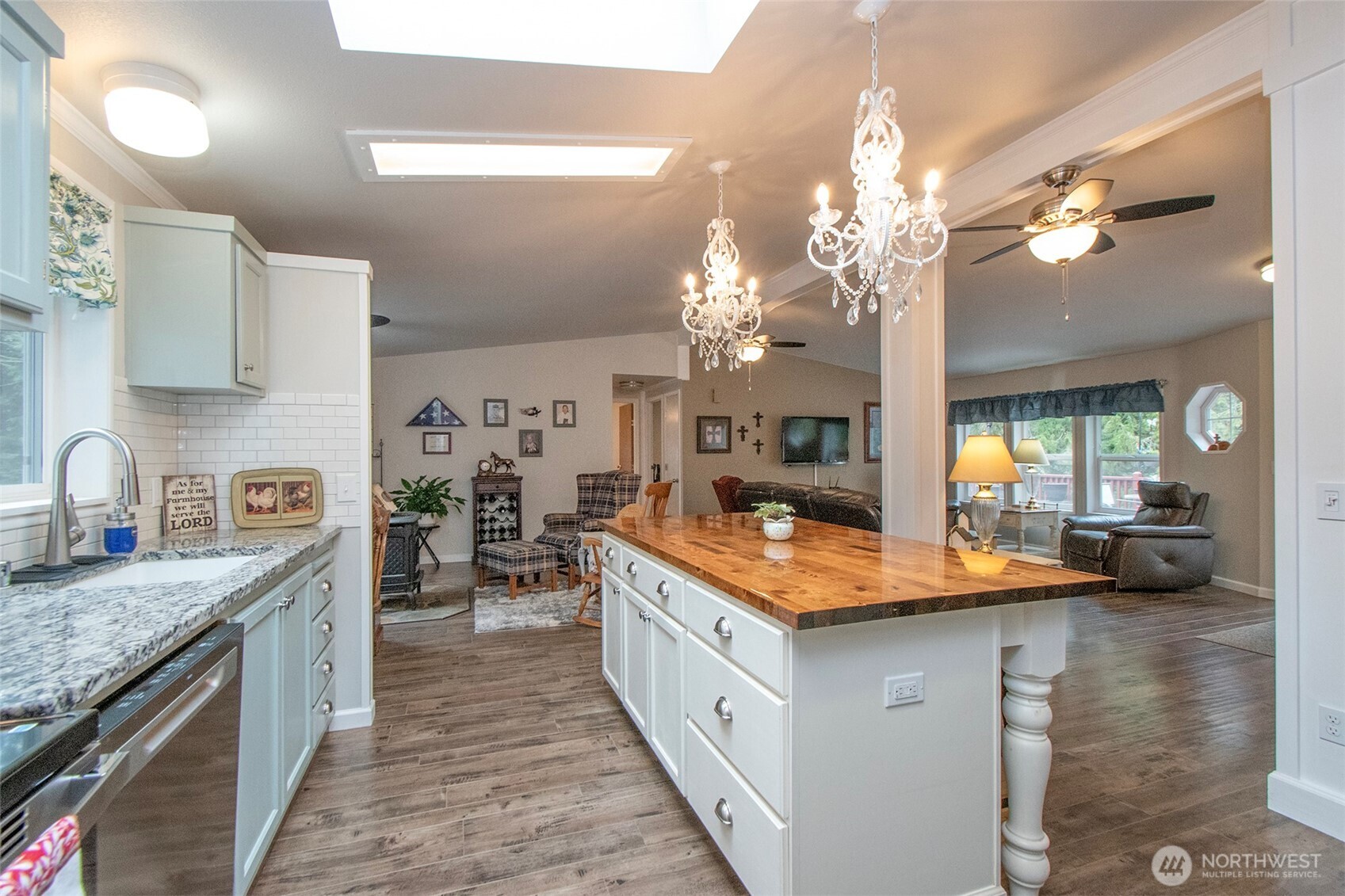 141 Lavender Ridge Lane Sequim, WA 98382 - Photo 15 of 40 a kitchen with stainless steel appliances granite countertop a sink stove and refrigerator