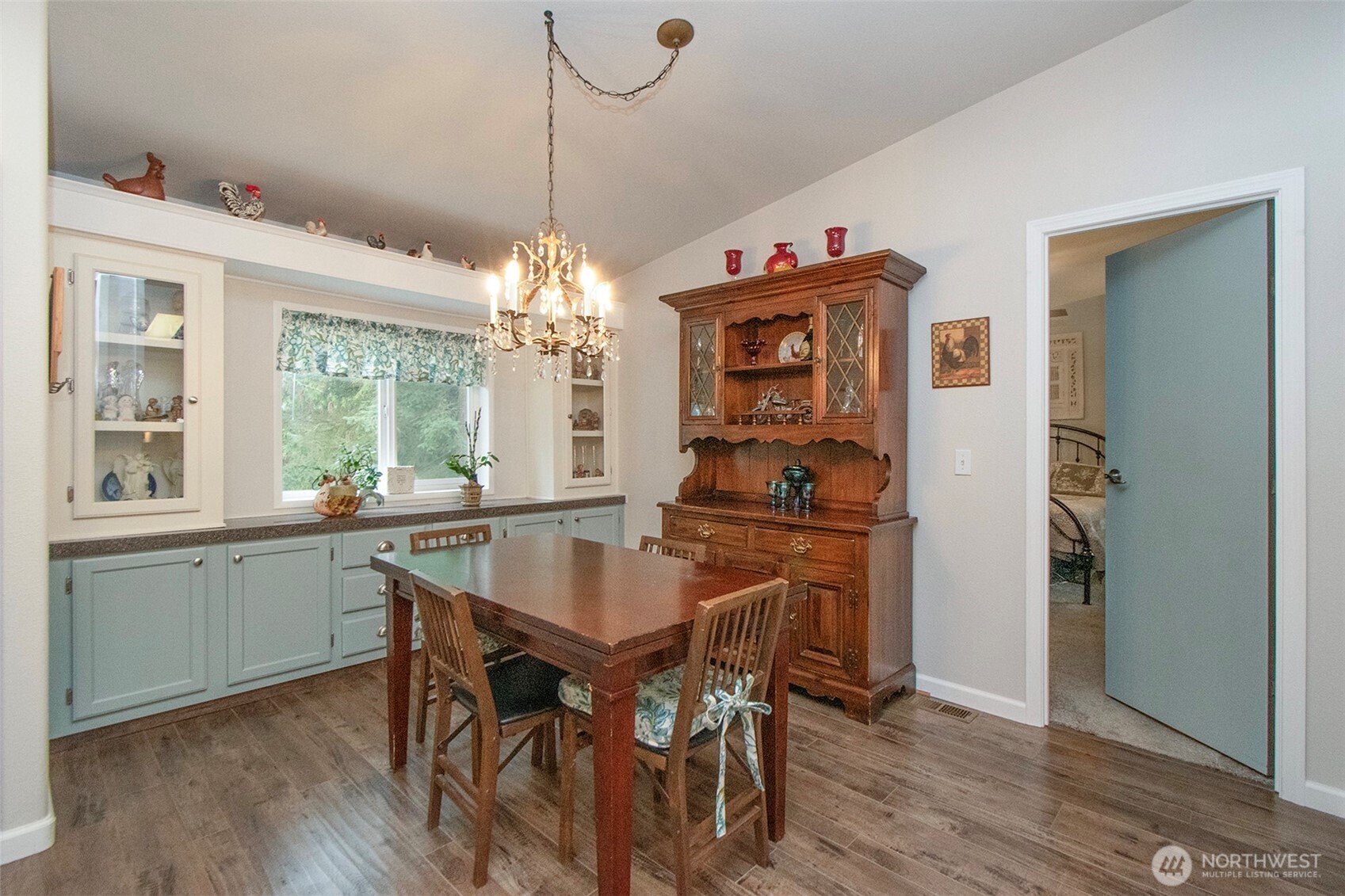 141 Lavender Ridge Lane Sequim, WA 98382 - Photo 18 of 40 a dining room with furniture a chandelier and wooden floor