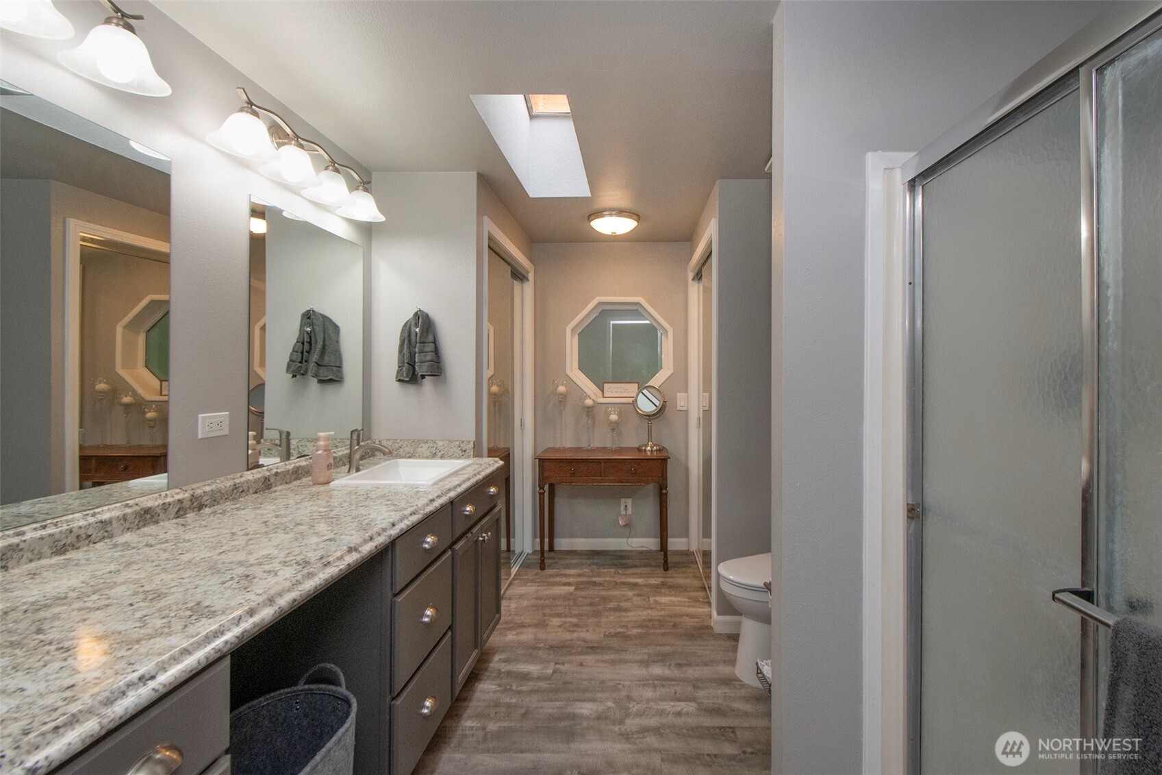 141 Lavender Ridge Lane Sequim, WA 98382 - Photo 22 of 40 a bathroom with a granite countertop double vanity sink and a mirror