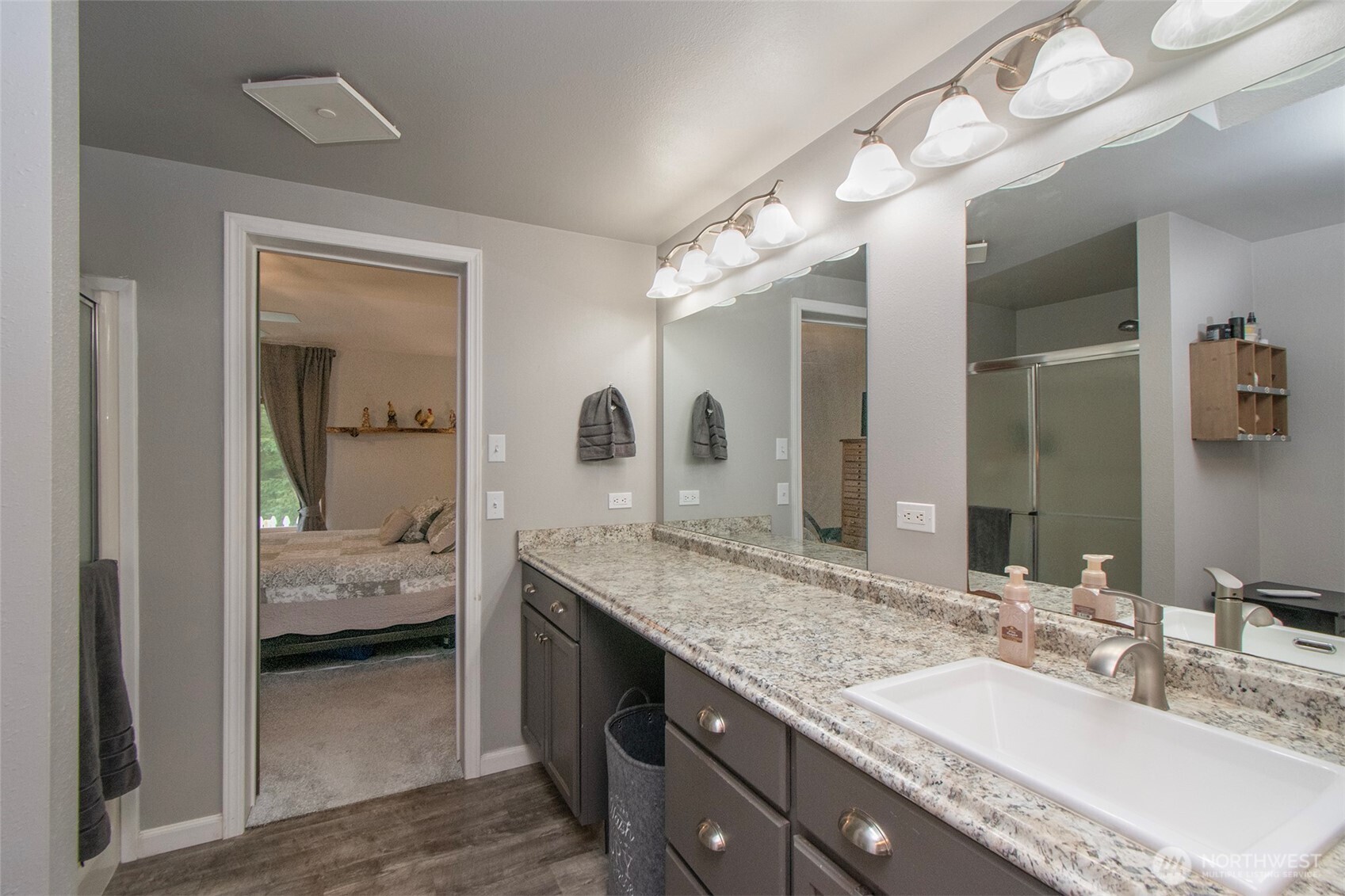 141 Lavender Ridge Lane Sequim, WA 98382 - Photo 24 of 40 a en suite bathroom with a granite countertop sink and a mirror