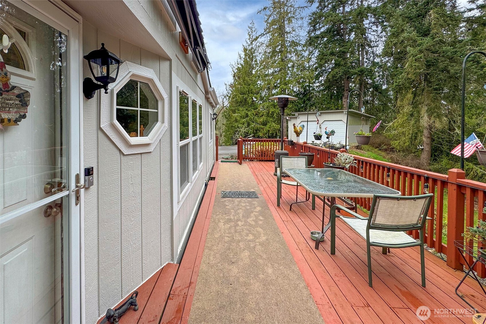 141 Lavender Ridge Lane Sequim, WA 98382 - Photo 6 of 40 a balcony with chairs and wooden floor