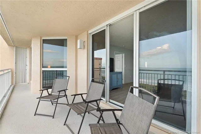 a view of a livingroom with furniture and windows