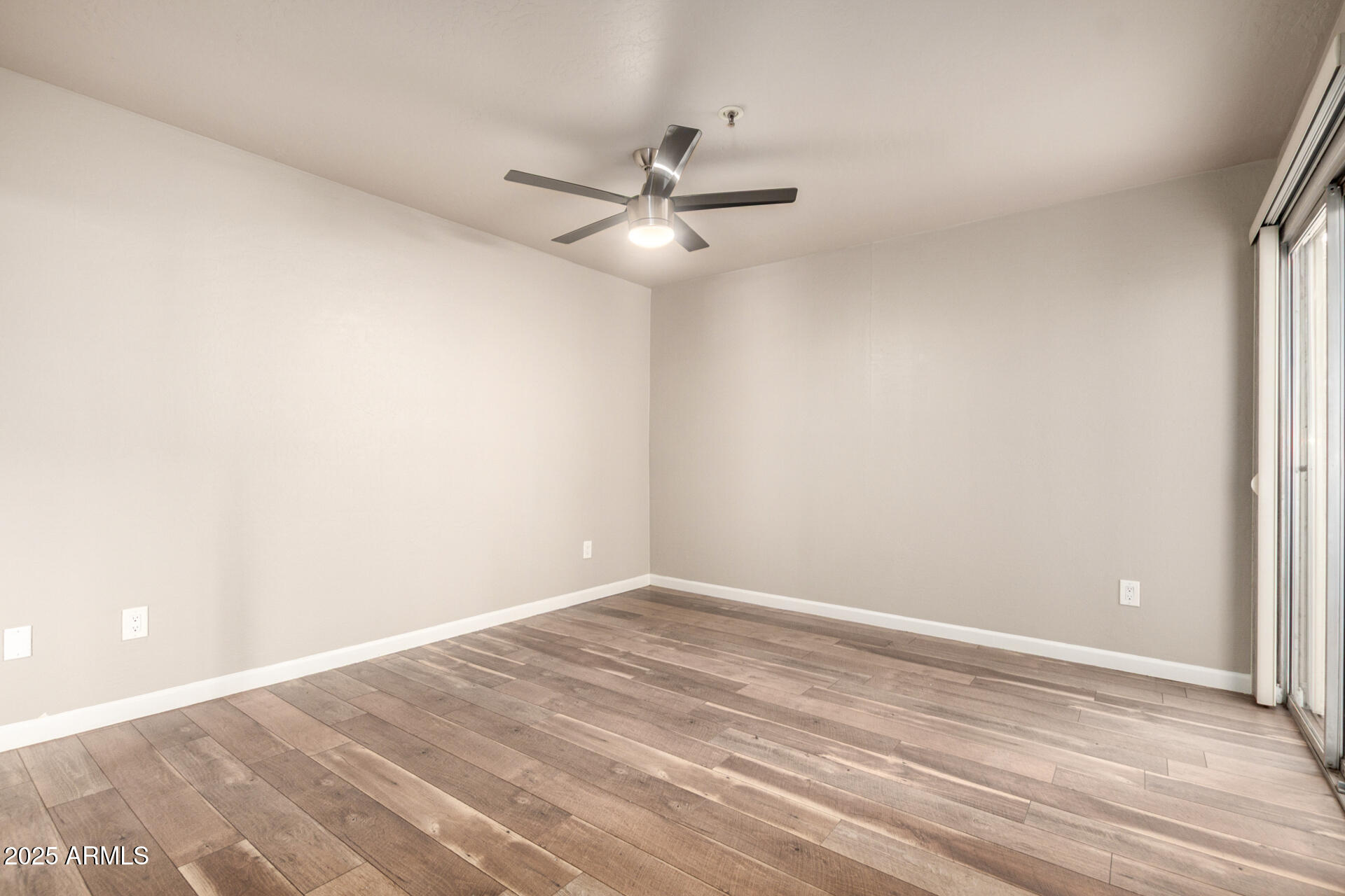 7494 East Earll Drive, Unit 107 Scottsdale, AZ 85251 - Photo 12 of 23 a view of an empty room with a window