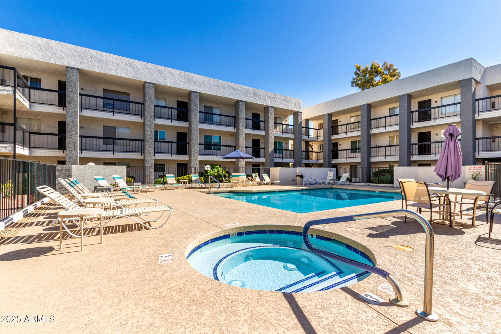 7494 East Earll Drive, Unit 107 Scottsdale, AZ 85251 - Photo 19 of 23 a swimming pool with outdoor seating and yard