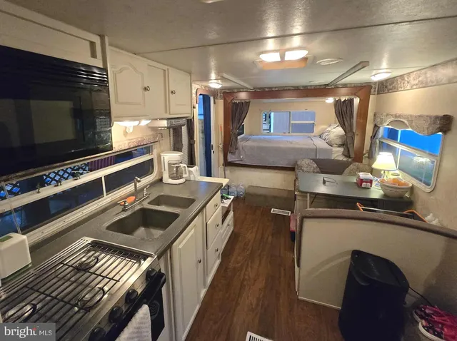 a kitchen with lots of counter top space and a sink