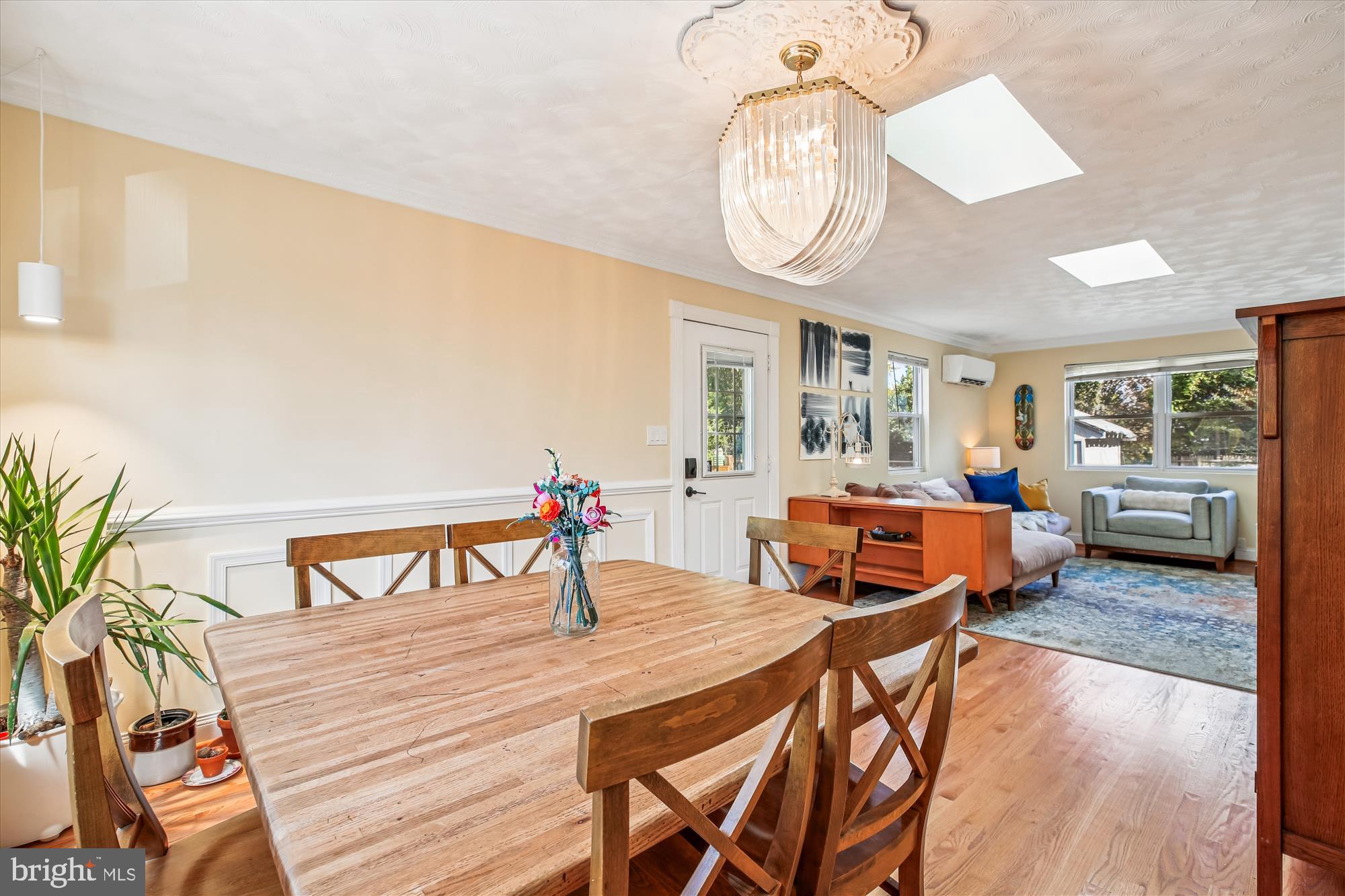 4805 Topping Road Rockville, MD 20852 - Photo 11 of 38 a living room with furniture a rug and a chandelier
