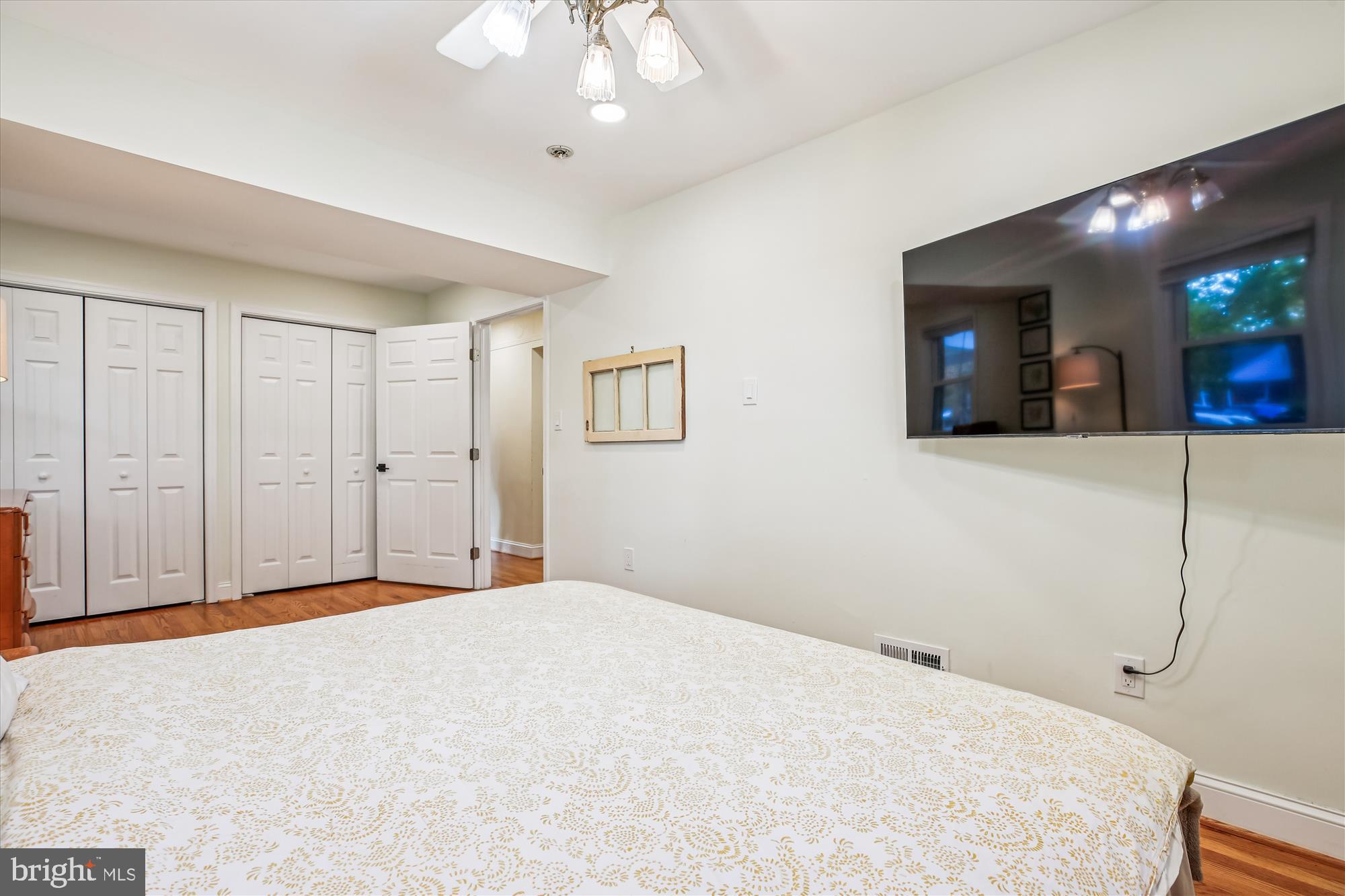 4805 Topping Road Rockville, MD 20852 - Photo 17 of 38 a bedroom with a bed and a chandelier