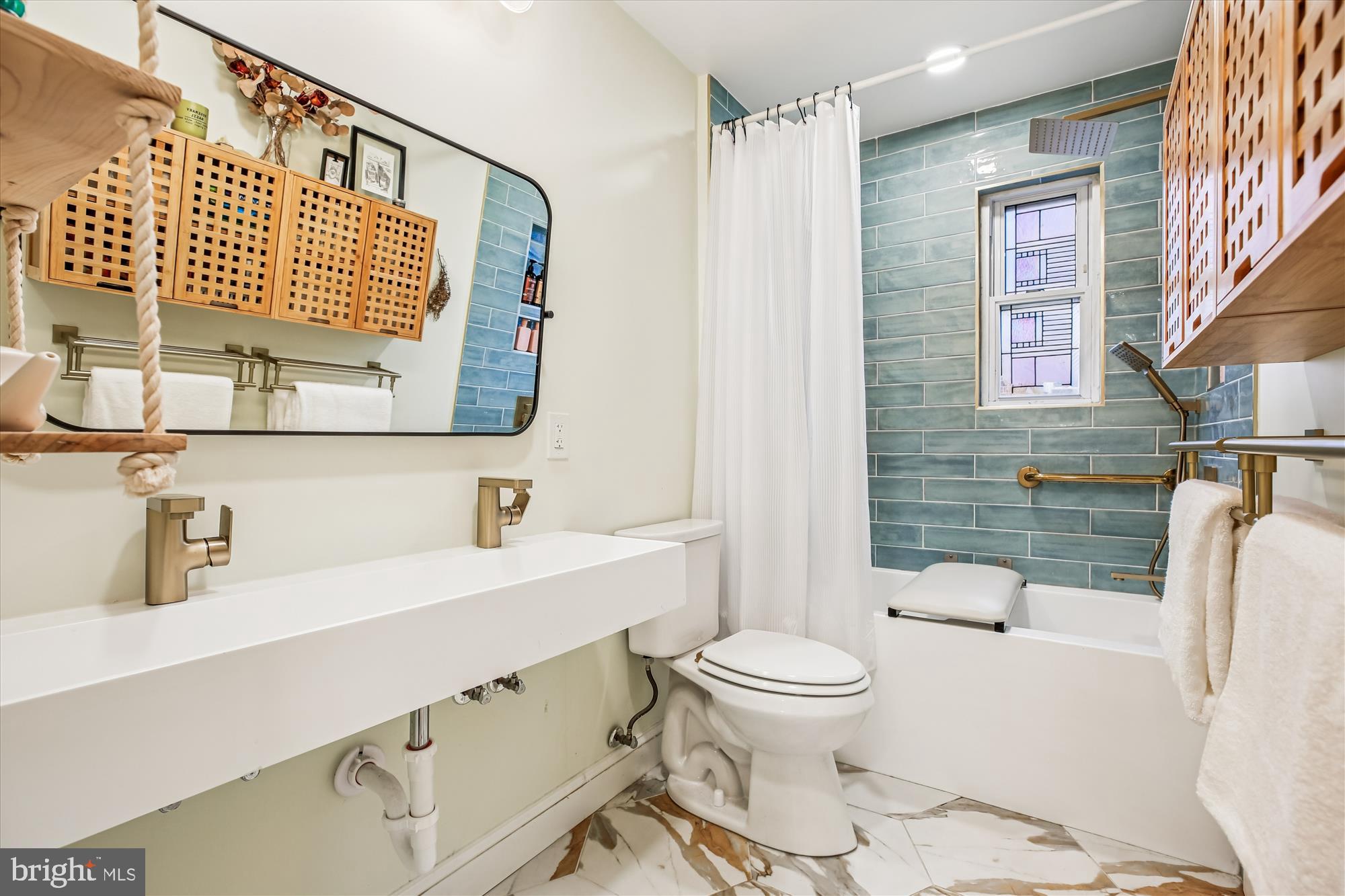 4805 Topping Road Rockville, MD 20852 - Photo 20 of 38 a bathroom with a sink a toilet and shower
