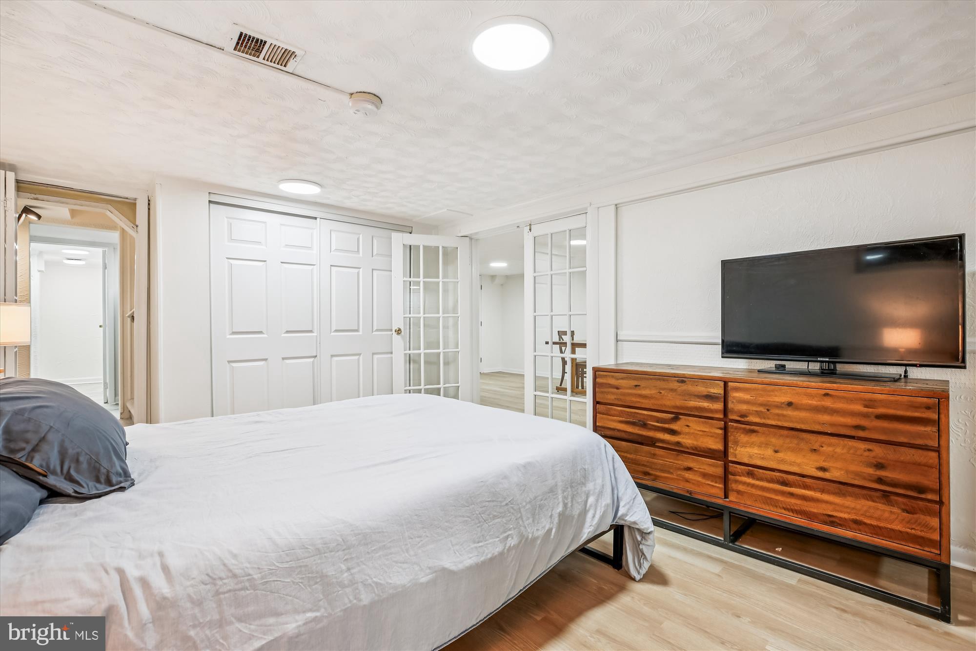 4805 Topping Road Rockville, MD 20852 - Photo 28 of 38 a bedroom with a bed and a flat screen tv