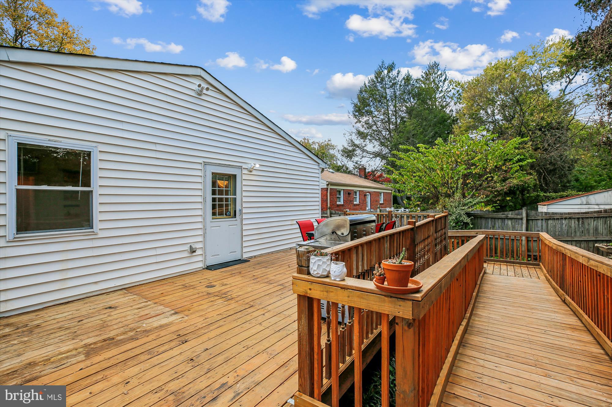 4805 Topping Road Rockville, MD 20852 - Photo 33 of 38 a view of house with wooden deck and furniture
