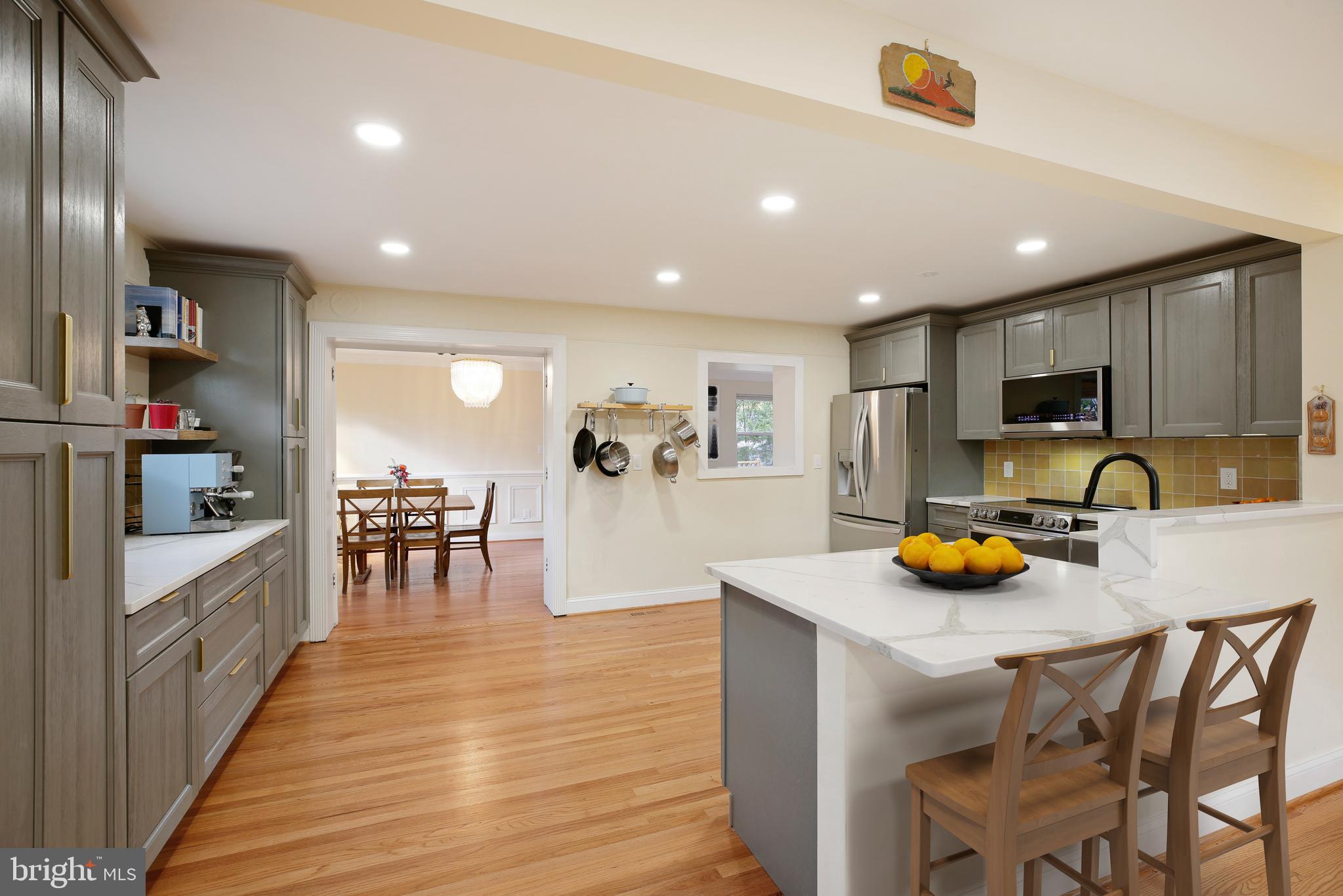 4805 Topping Road Rockville, MD 20852 - Photo 6 of 38 a kitchen with a sink a table and chairs