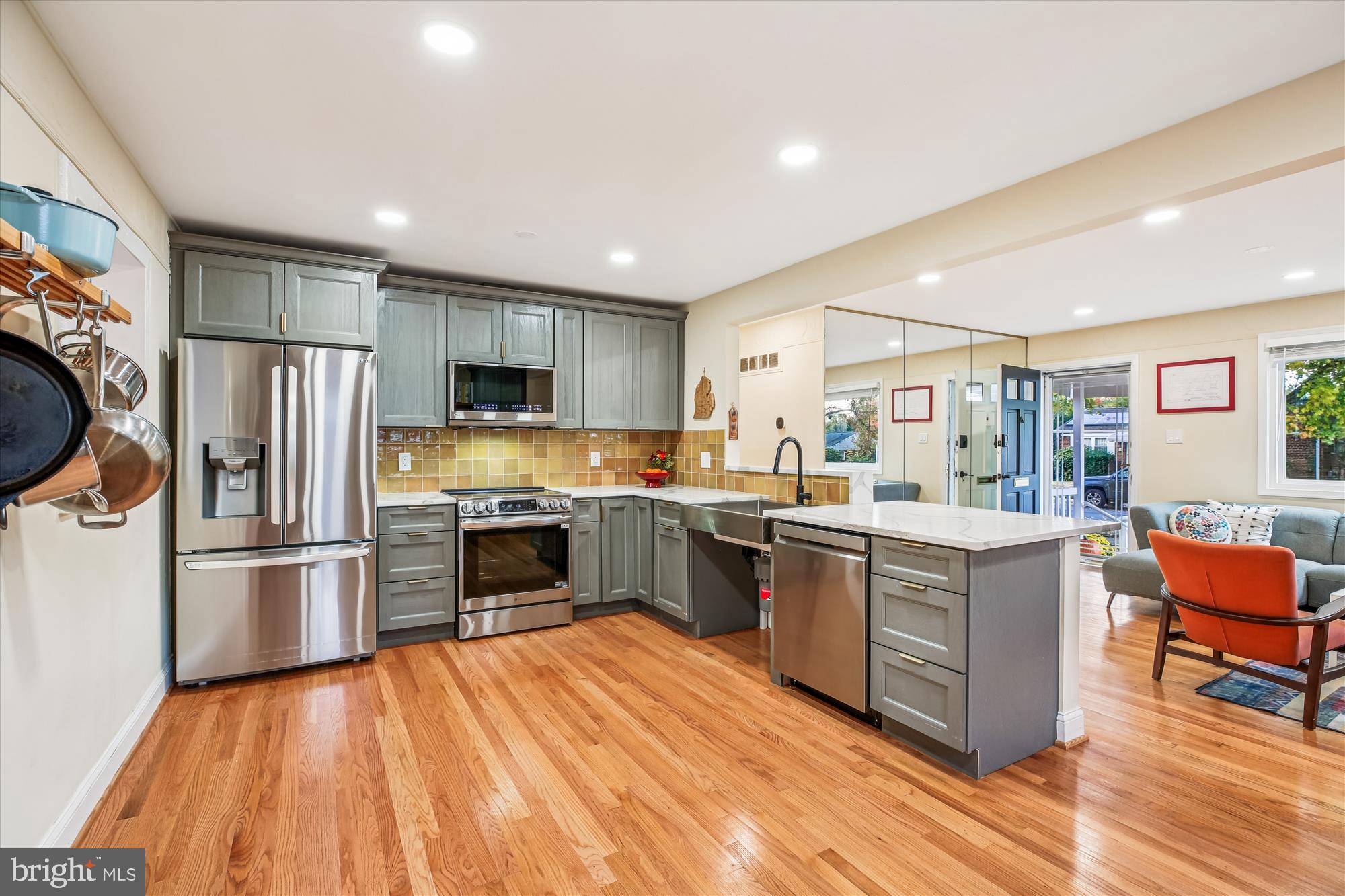 4805 Topping Road Rockville, MD 20852 - Photo 8 of 38 a kitchen with stainless steel appliances granite countertop a refrigerator a stove top oven a sink dishwasher and wooden cabinets with large window