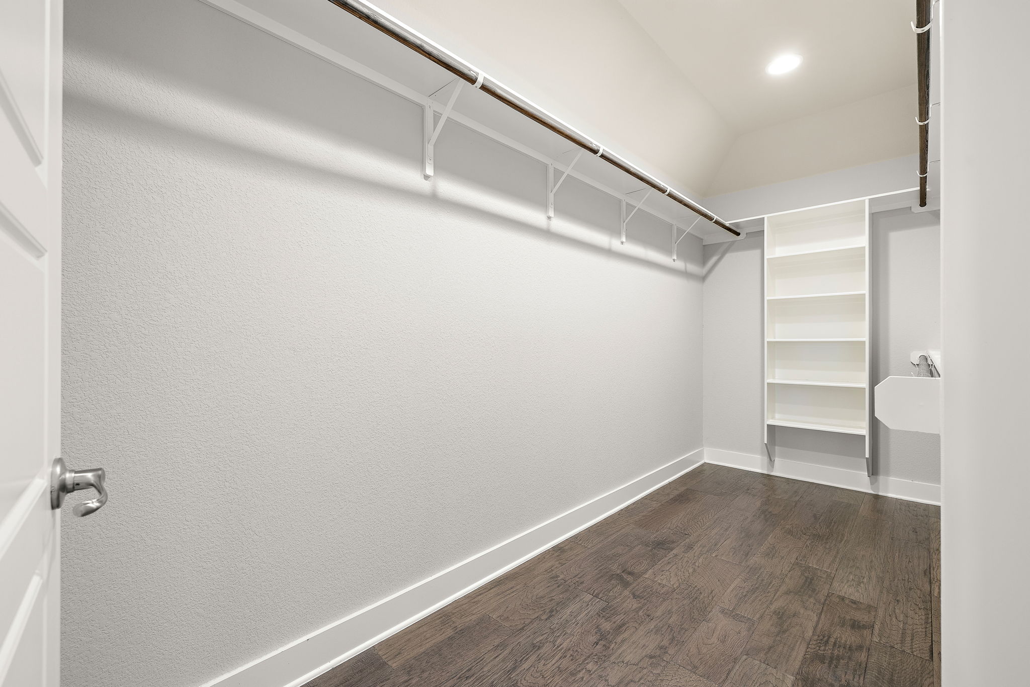 7520 Kinross Trail Austin, TX 78754 - Photo 19 of 37 Walk in closet with dark wood-style flooring