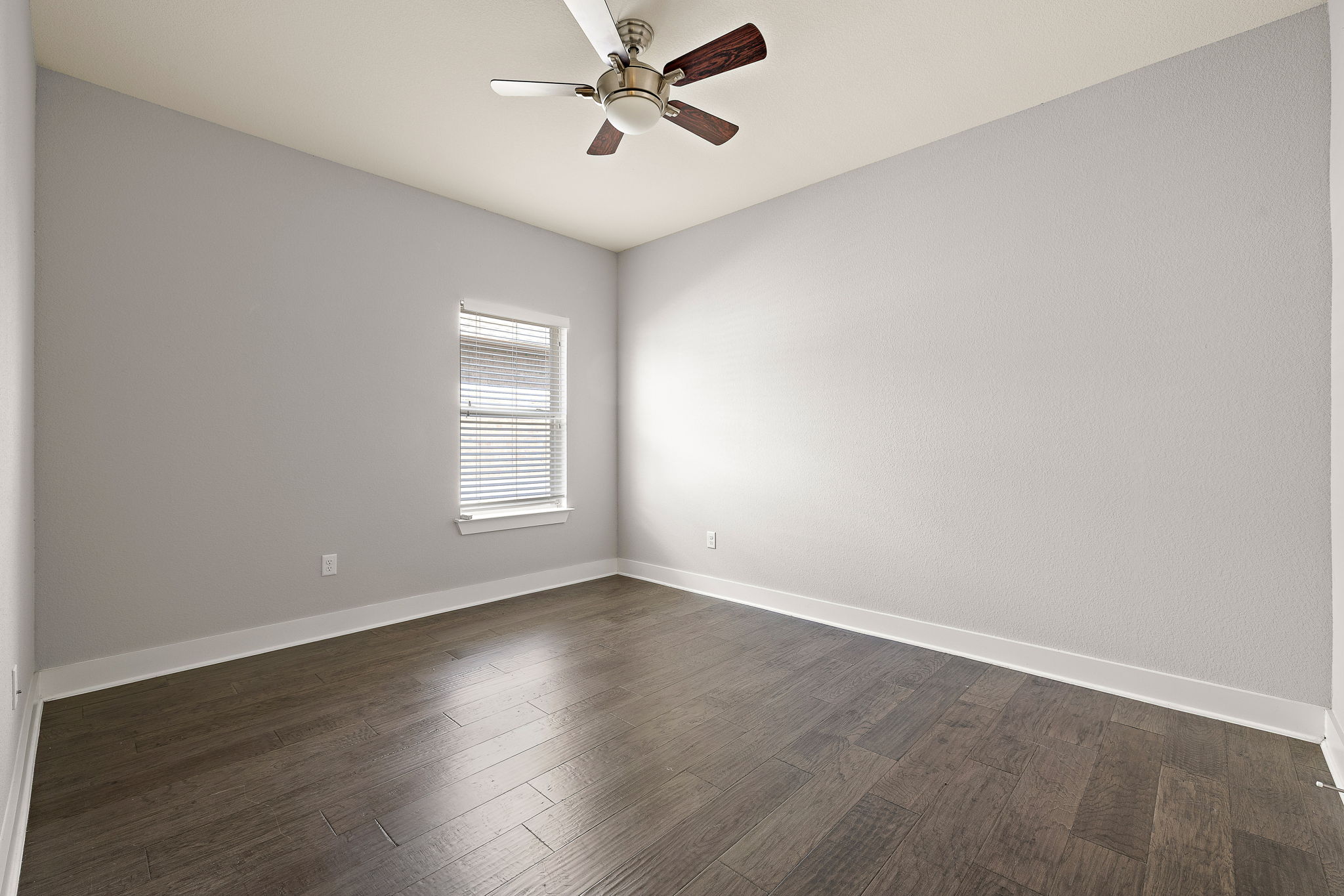 7520 Kinross Trail Austin, TX 78754 - Photo 23 of 37 Spare room with a ceiling fan and dark wood finished floors