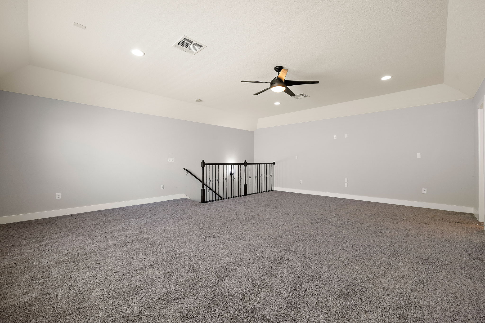 7520 Kinross Trail Austin, TX 78754 - Photo 28 of 37 Unfurnished room featuring a ceiling fan, dark carpet, and recessed lighting