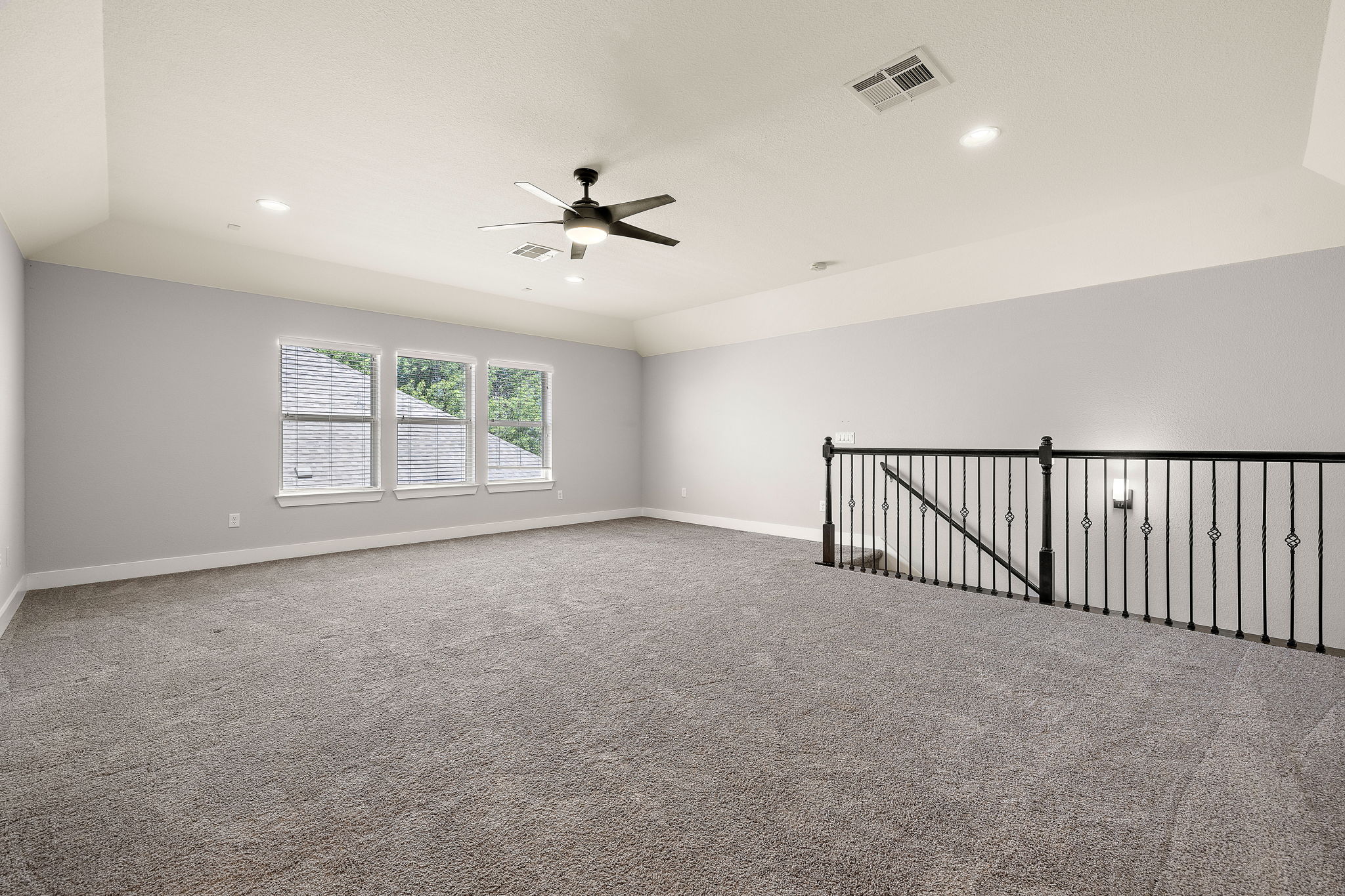 7520 Kinross Trail Austin, TX 78754 - Photo 29 of 37 Carpeted empty room with a ceiling fan, recessed lighting, and lofted ceiling