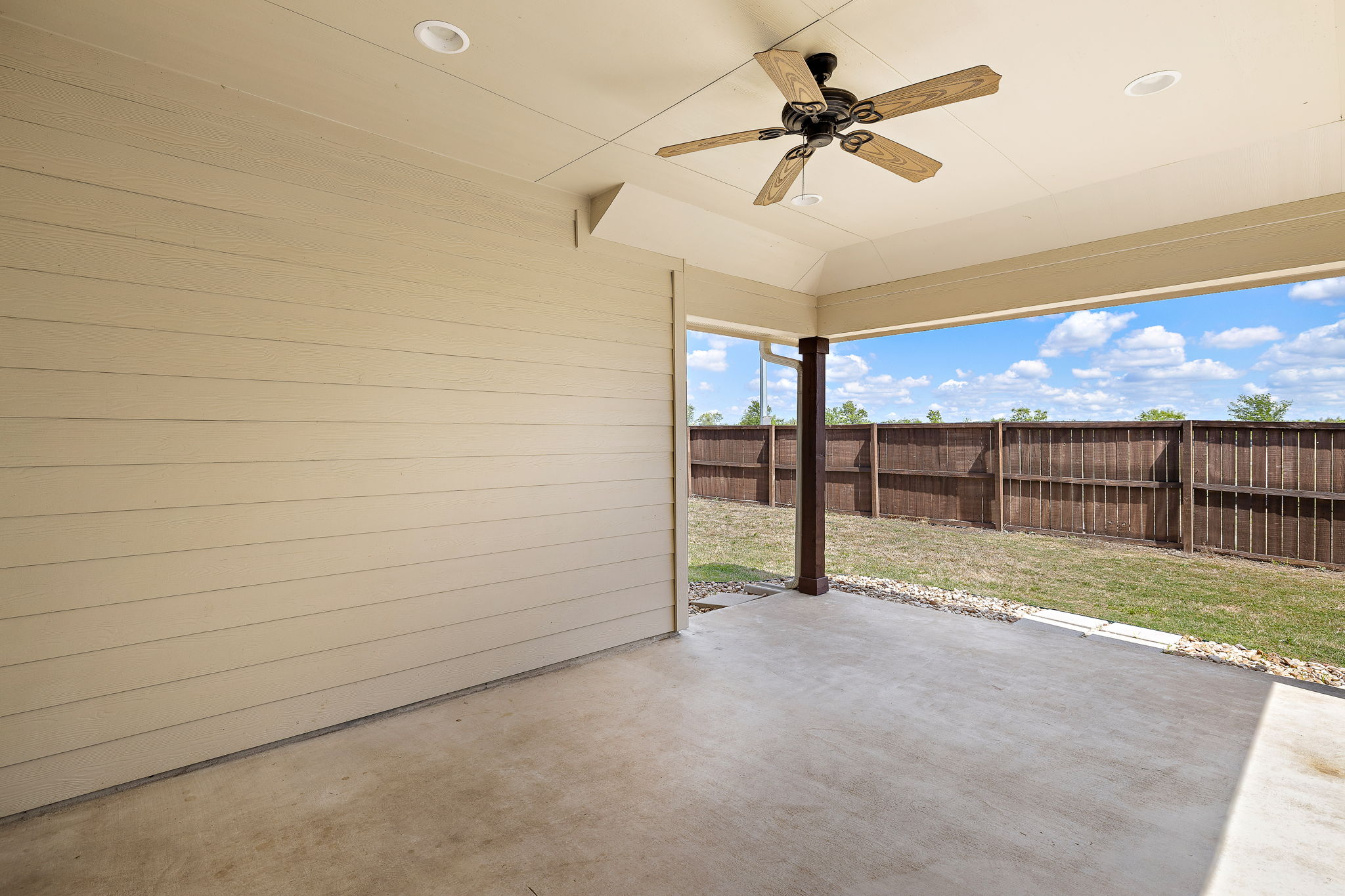 7520 Kinross Trail Austin, TX 78754 - Photo 31 of 37 Fenced backyard with a ceiling fan and a patio area
