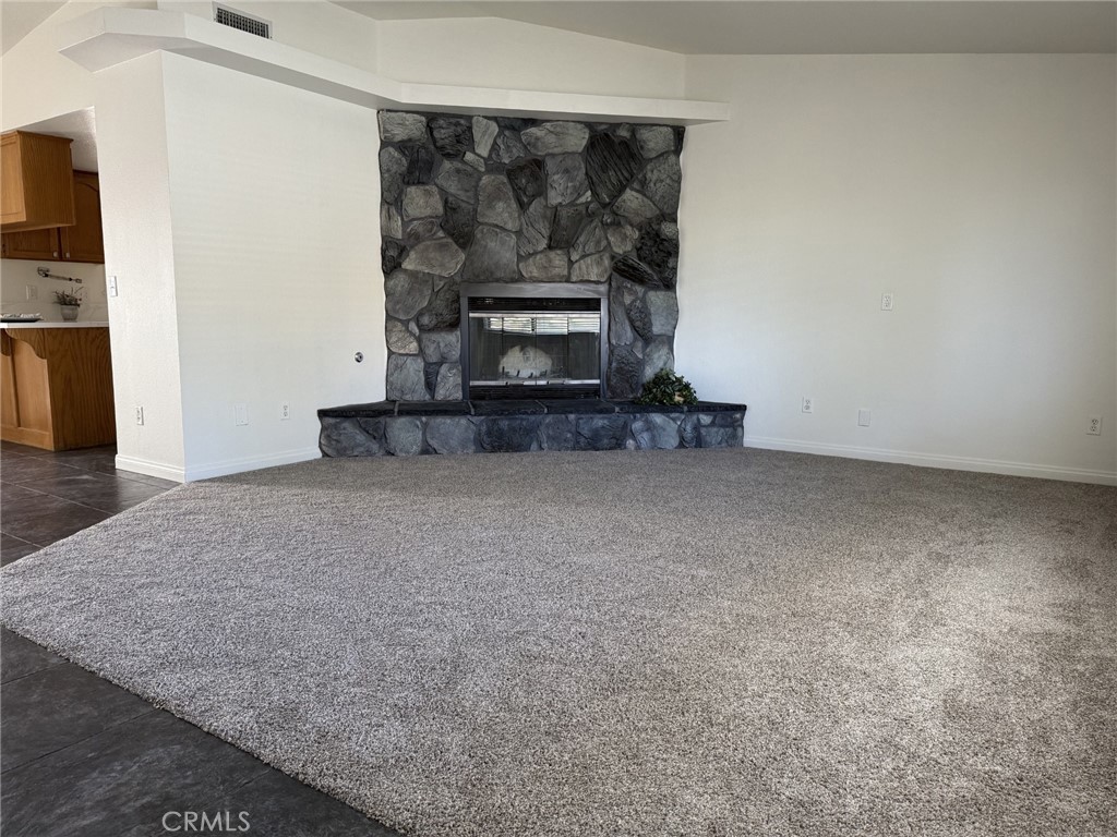 16042 St Timothy Road Apple Valley, CA 92307 - Photo 3 of 26 a view of an empty room and fire place