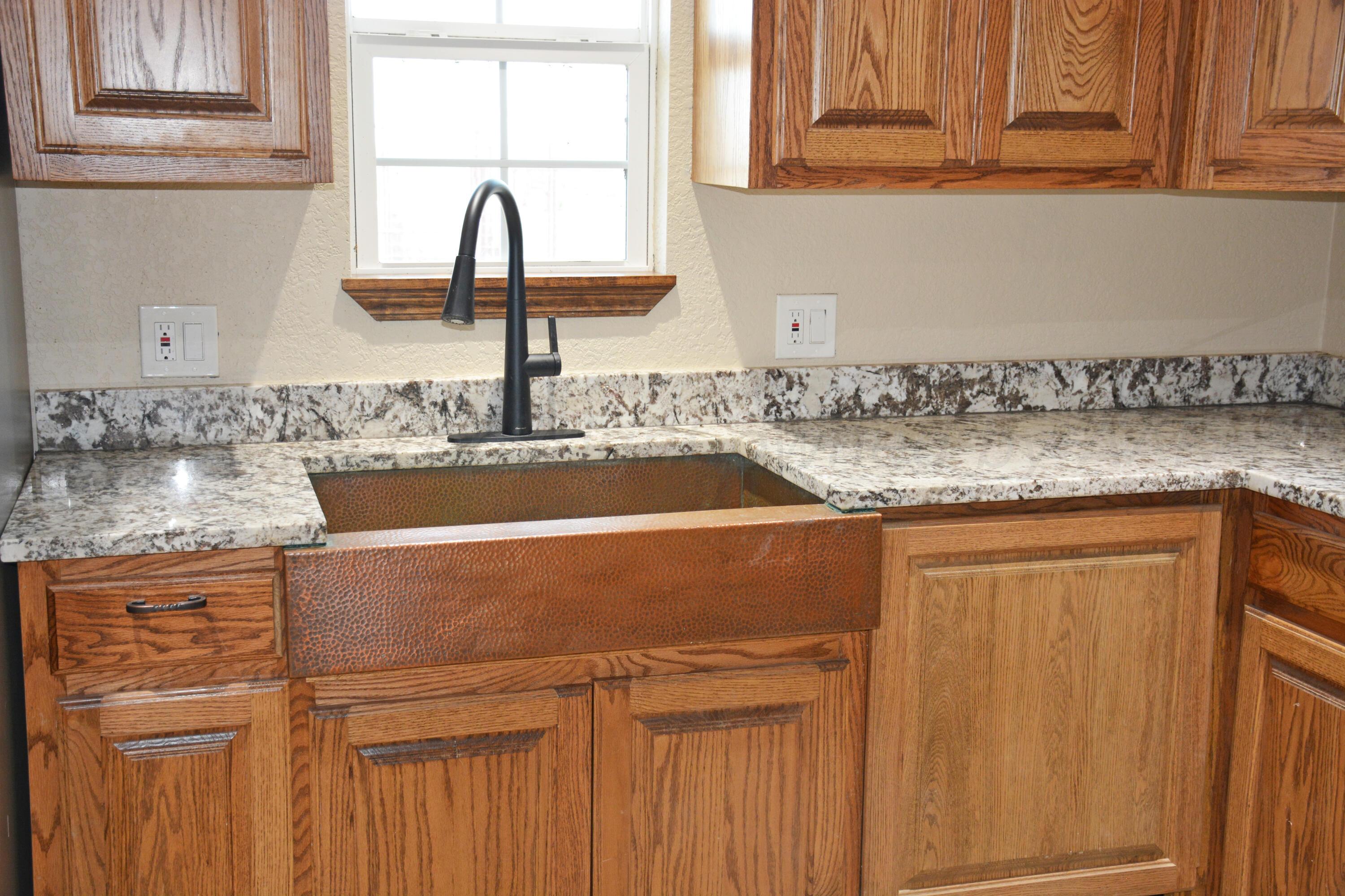 1159 Fm 1760 Muleshoe, TX 79347 - Photo 12 of 34 a close view of sink and tap