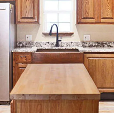 a view of granite countertop cabinets and window