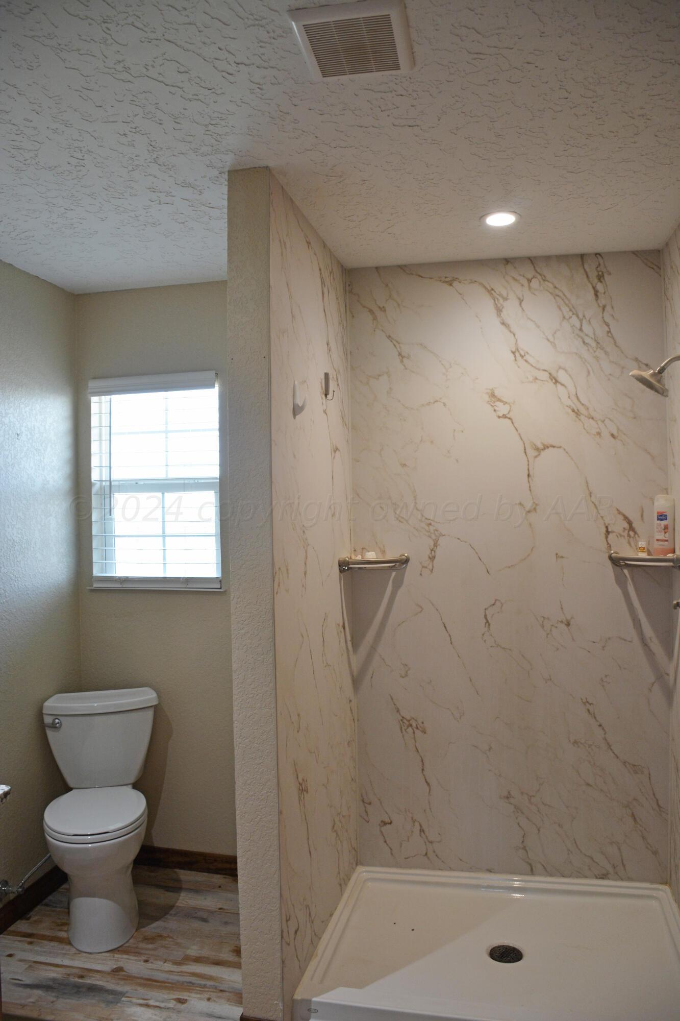 1159 Fm 1760 Muleshoe, TX 79347 - Photo 17 of 34 a bathroom with a toilet and a shower